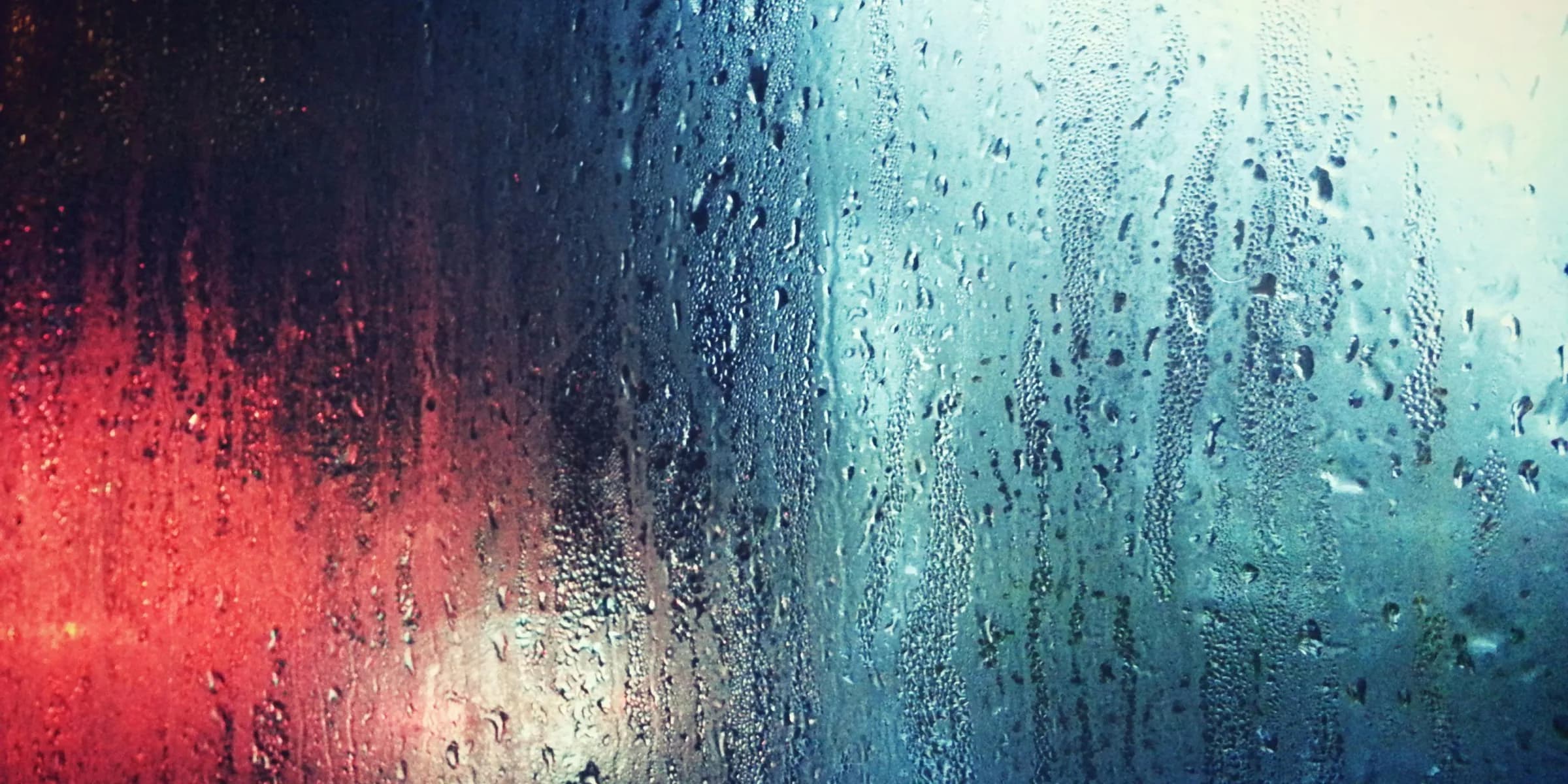 a close up of a window with rain drops