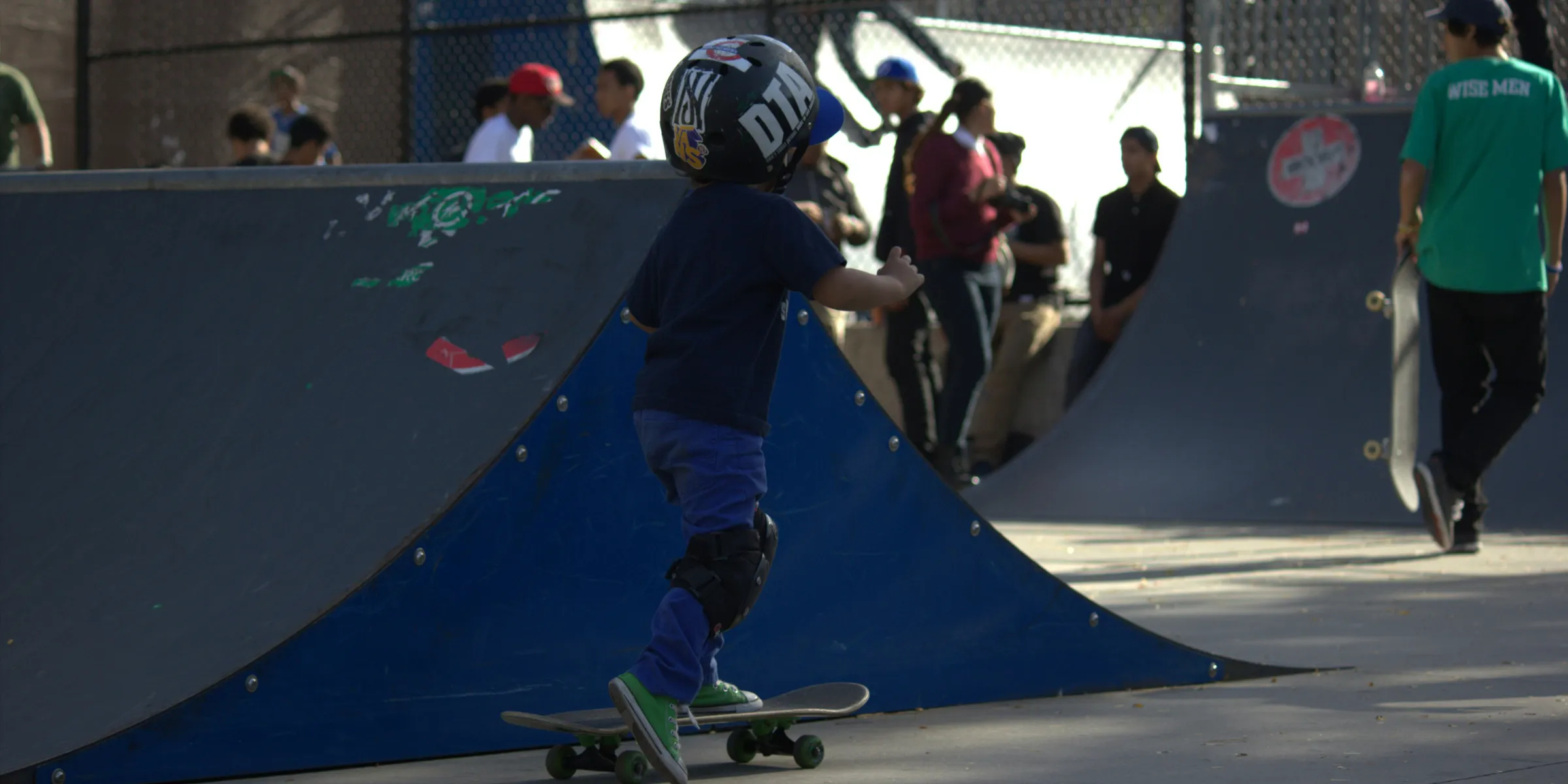 A man riding a skateboard on top of a ramp