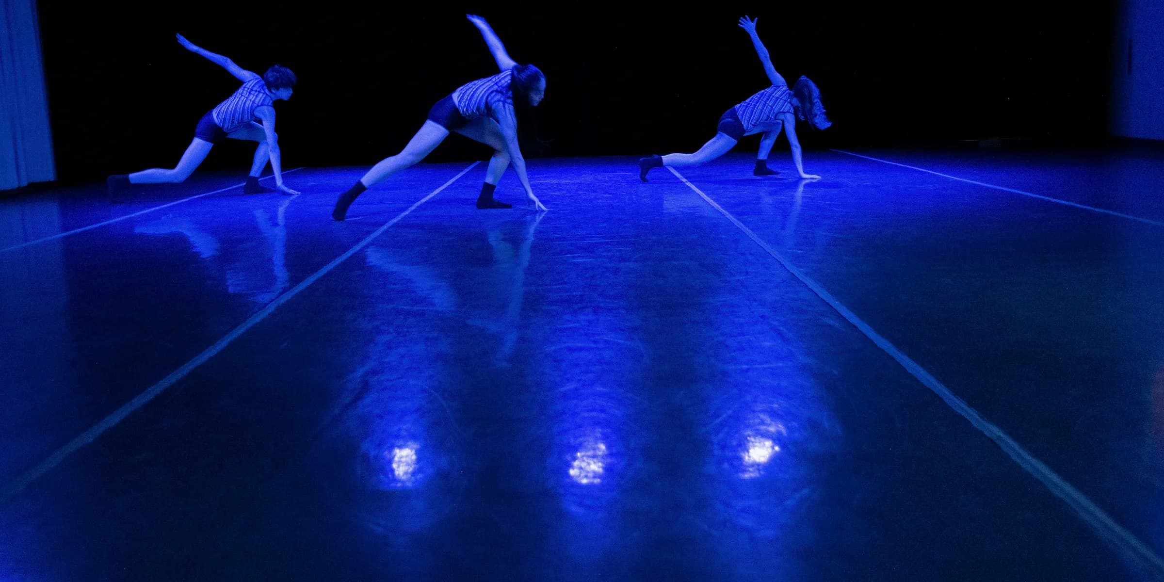 a group of dancers performing on a stage