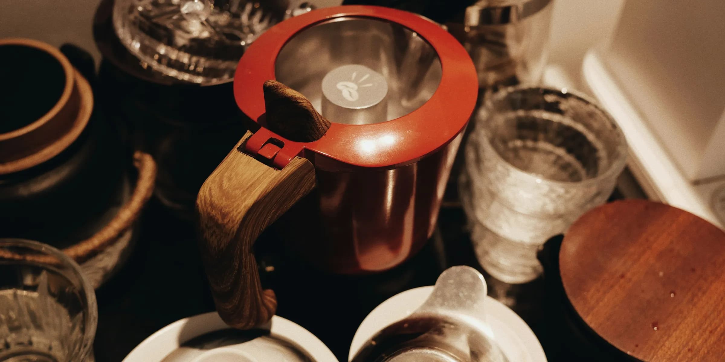 A table topped with lots of dishes and cups
