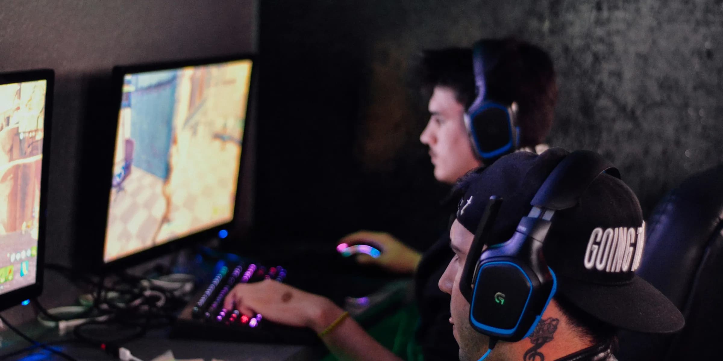 two men playing PC games