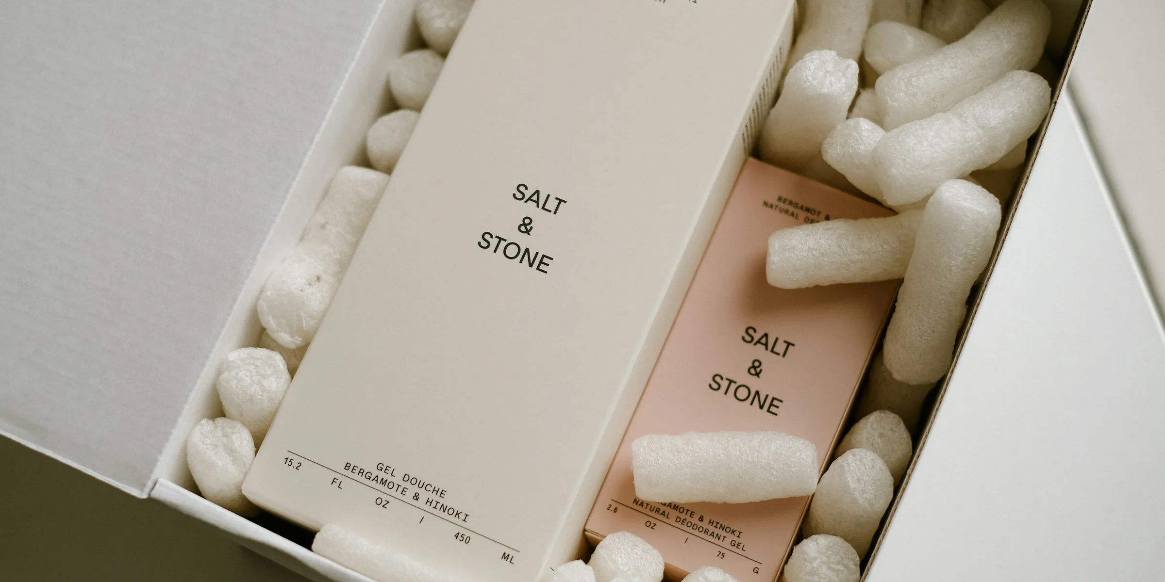 a white box filled with white and pink items