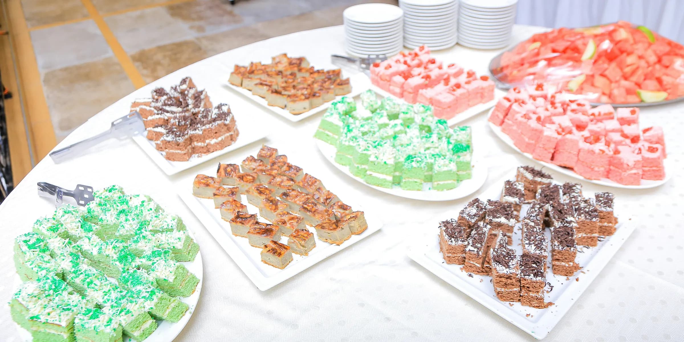 a table topped with lots of different types of desserts