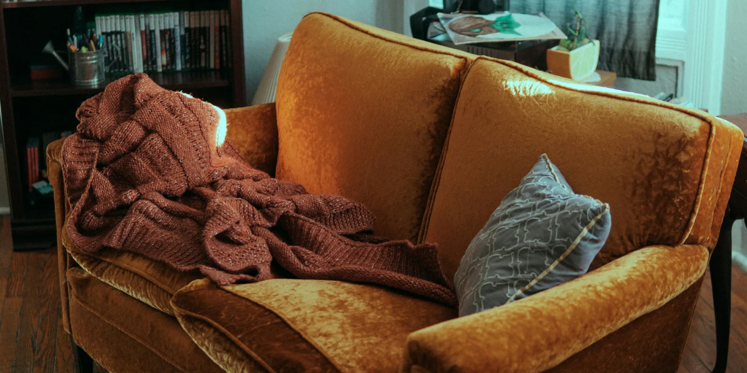 blanket and pillow on sofa