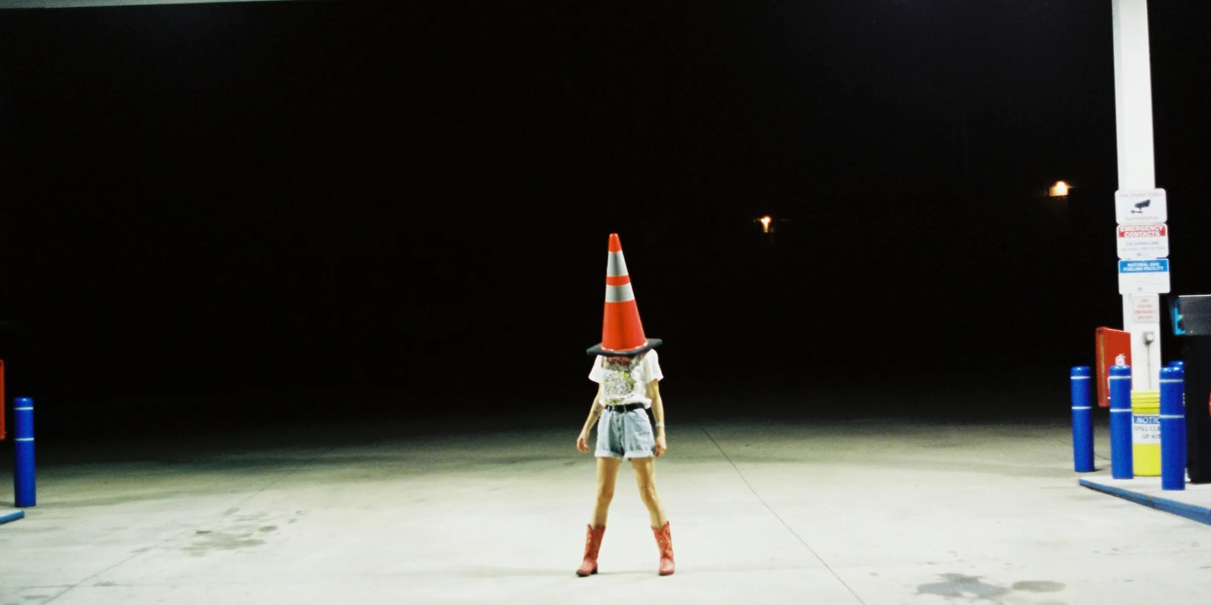 person wearing street cone