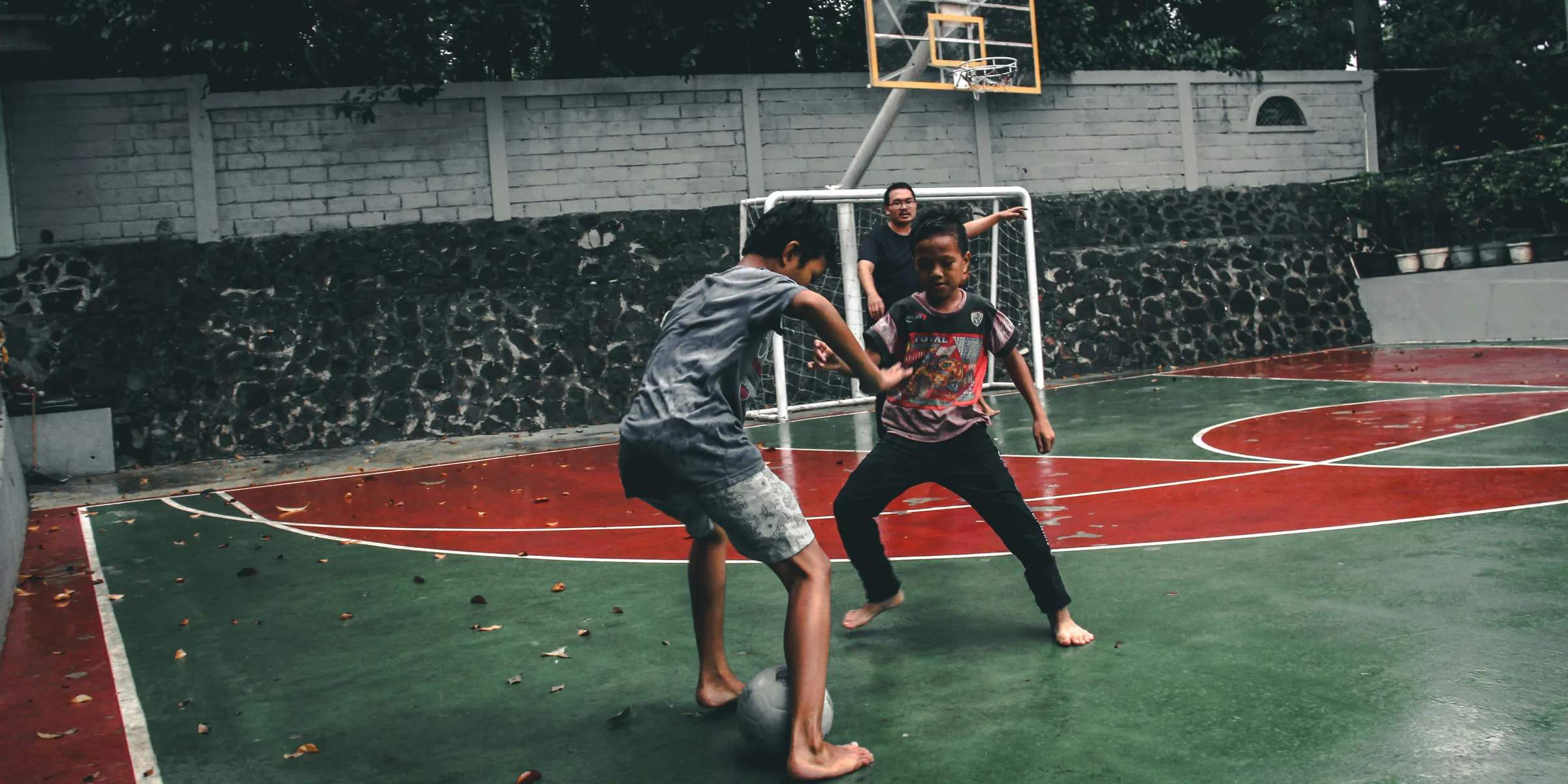 two boys playing tiger football