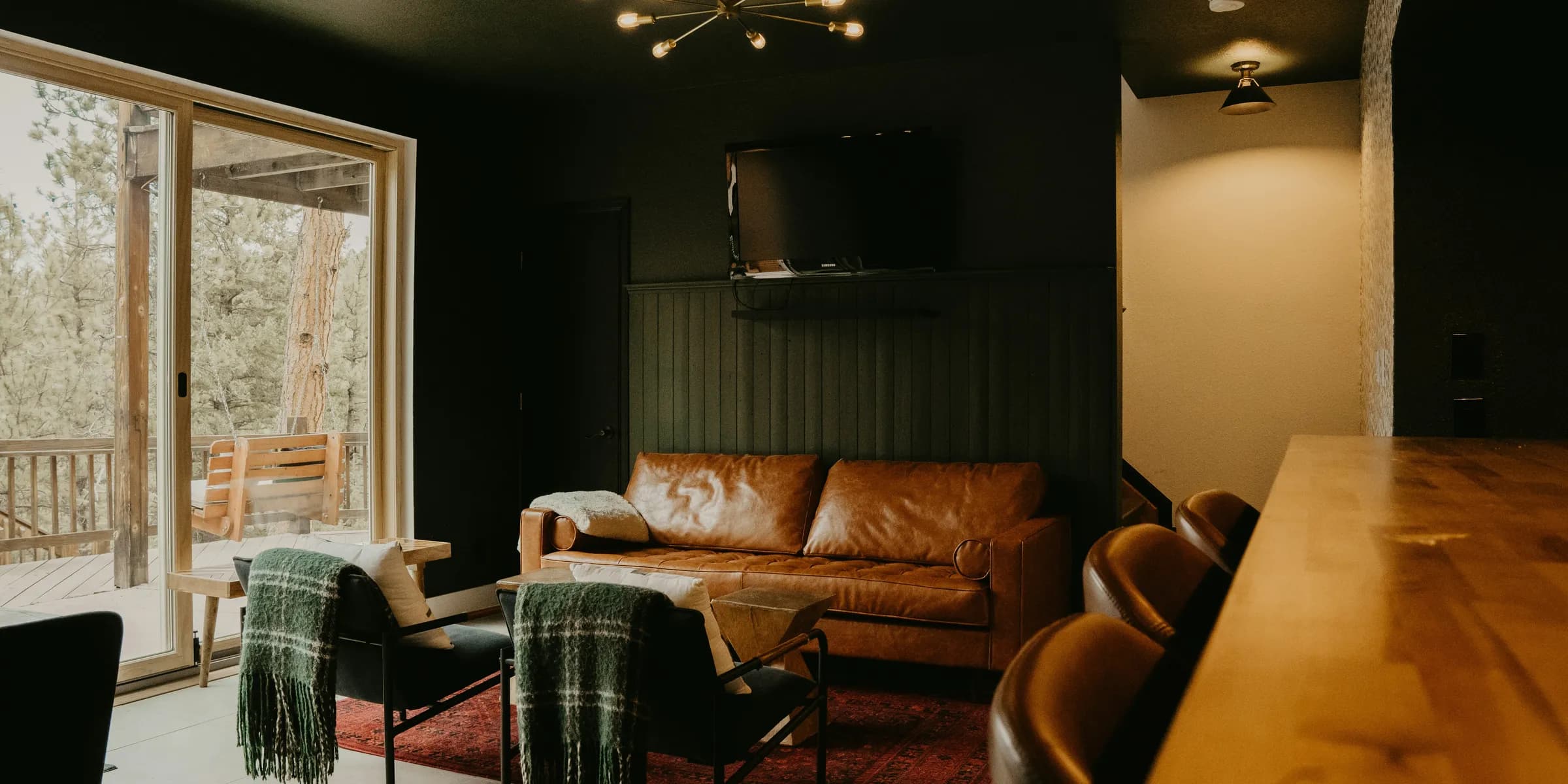 a living room filled with furniture and a flat screen tv