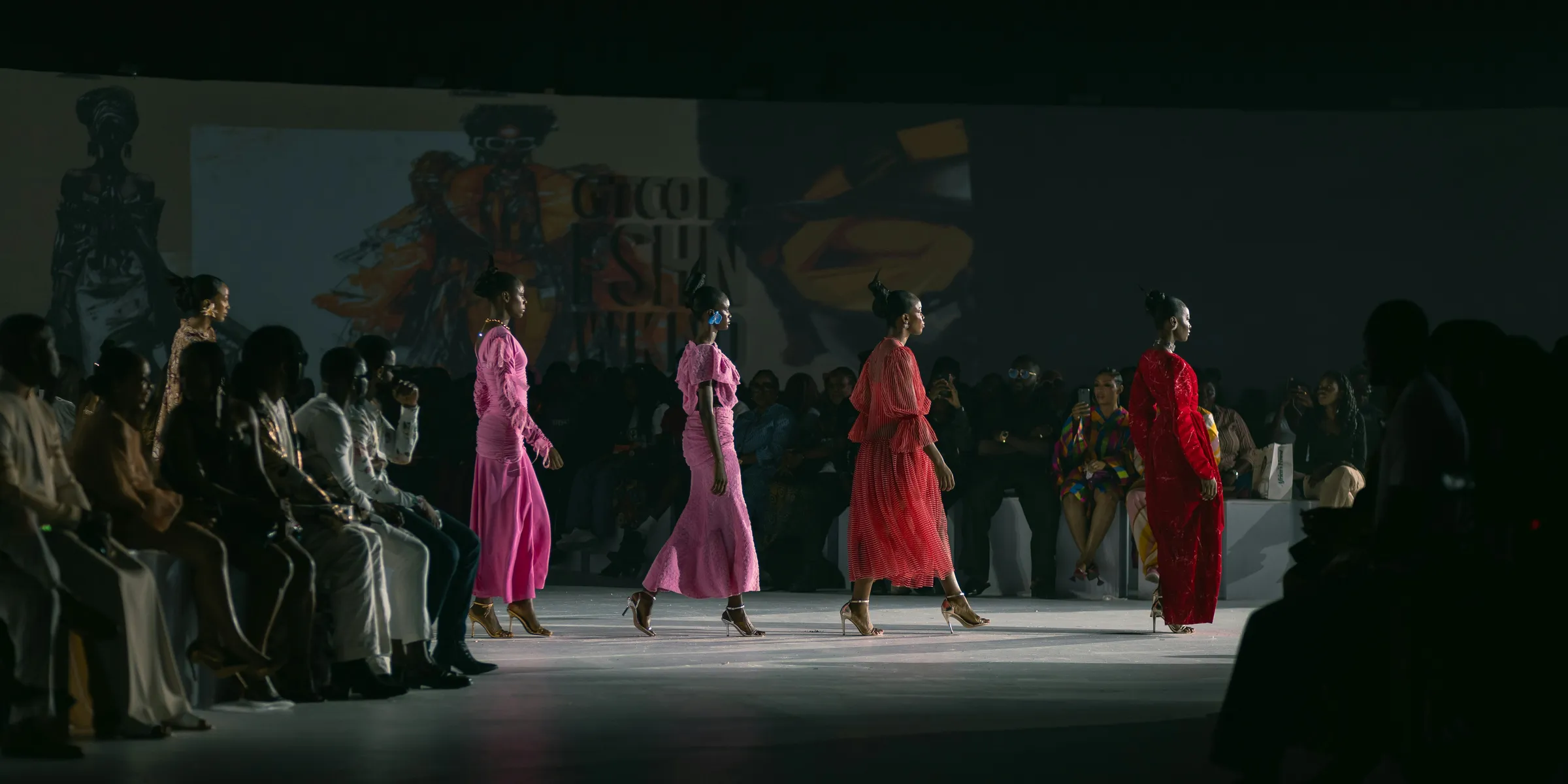A group of women walking down a runway