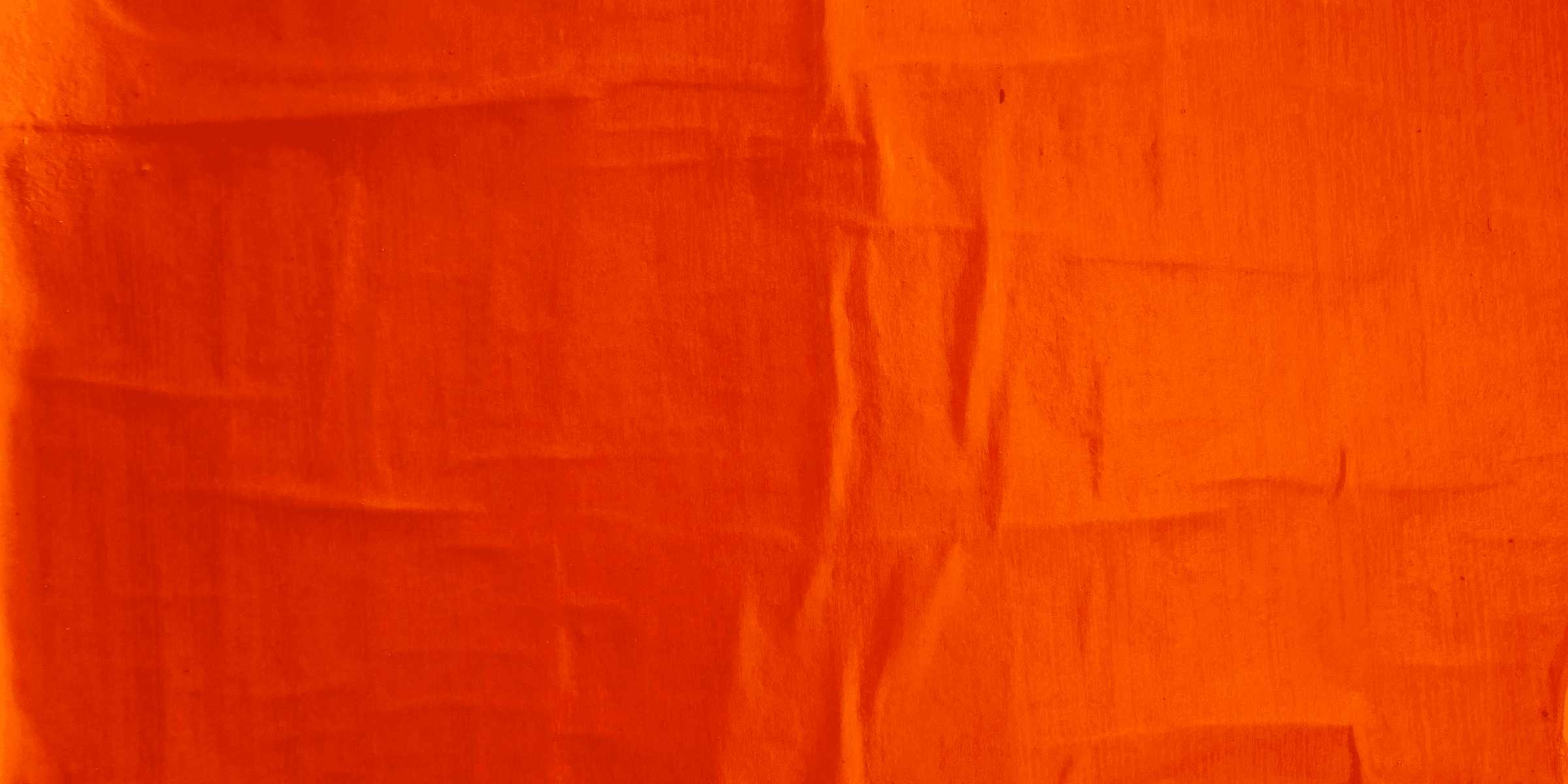 orange textile on white textile