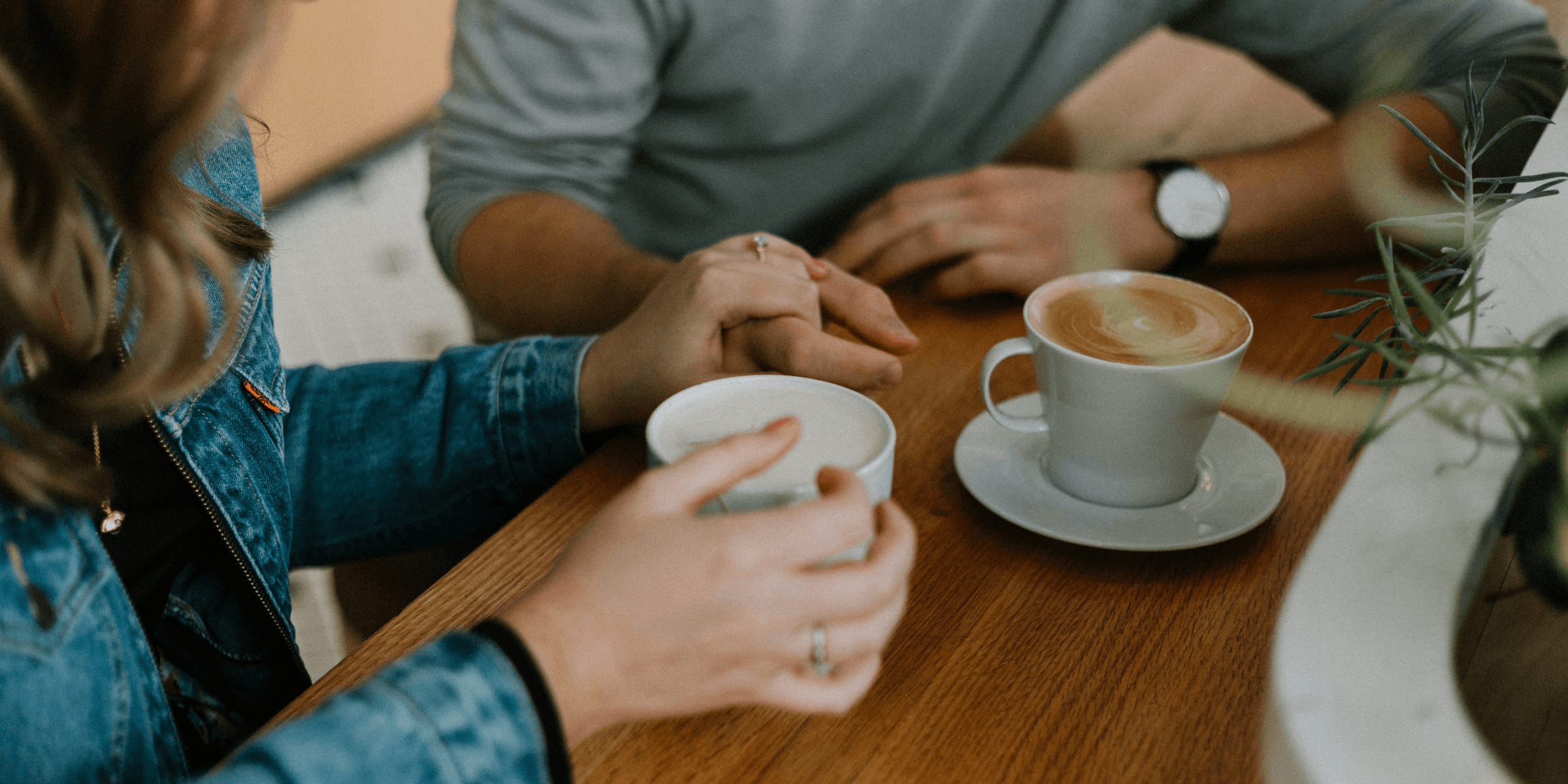 two mugs with coffee on table
