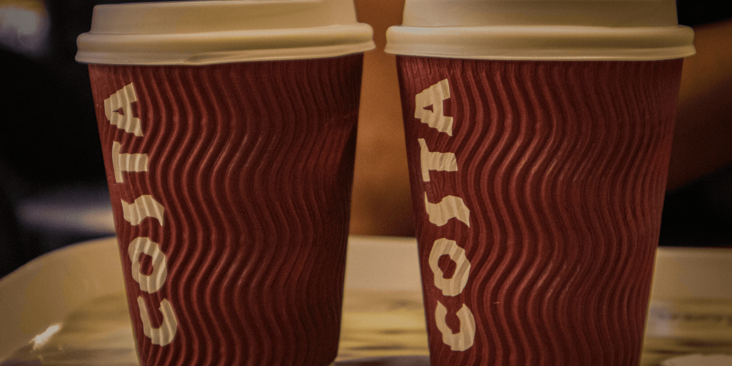 a couple of cups with liquid in them.