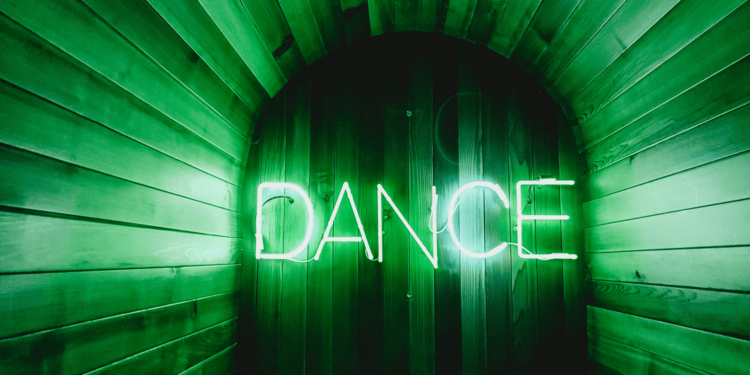 brown door with Dance neon lights.