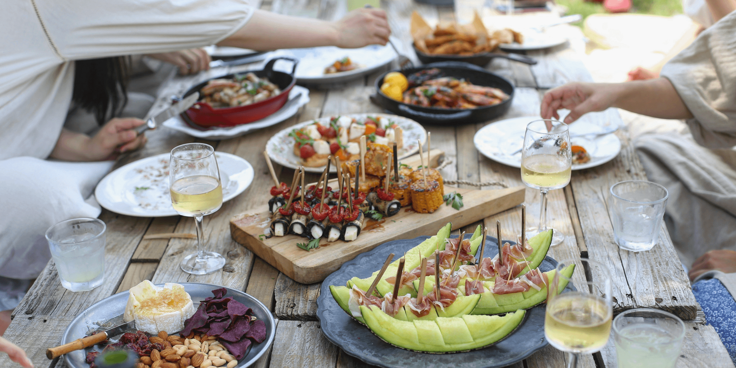 group of people eating on backyard.