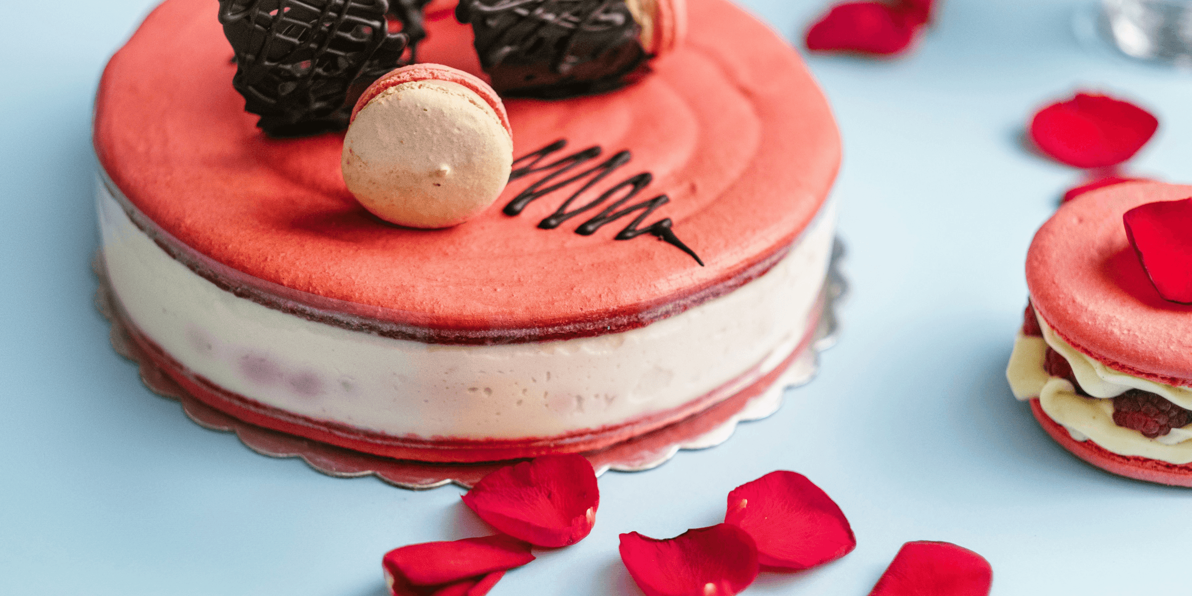 round red and white cake with cookies toppings.