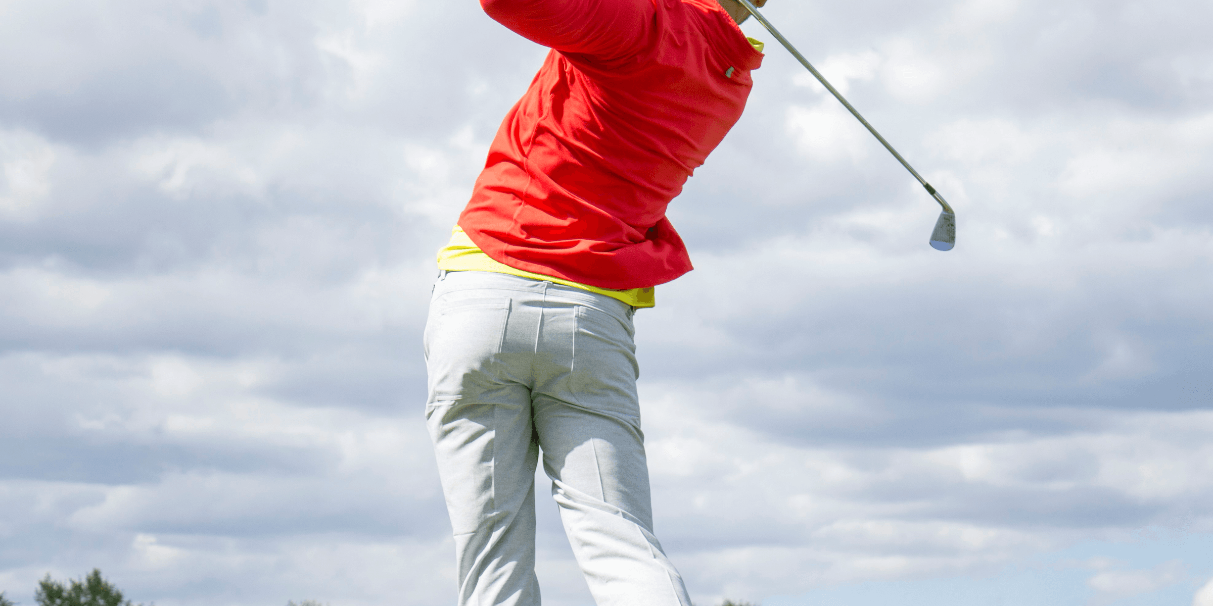 man in red long-sleeved top golf.