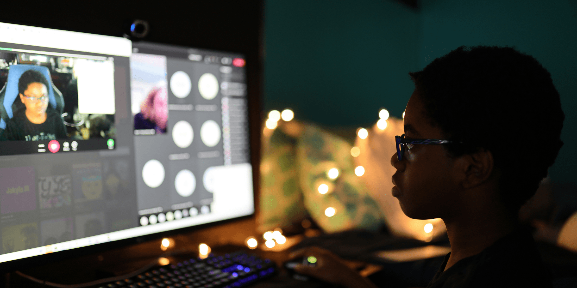 woman in black shirt wearing black framed eyeglasses.