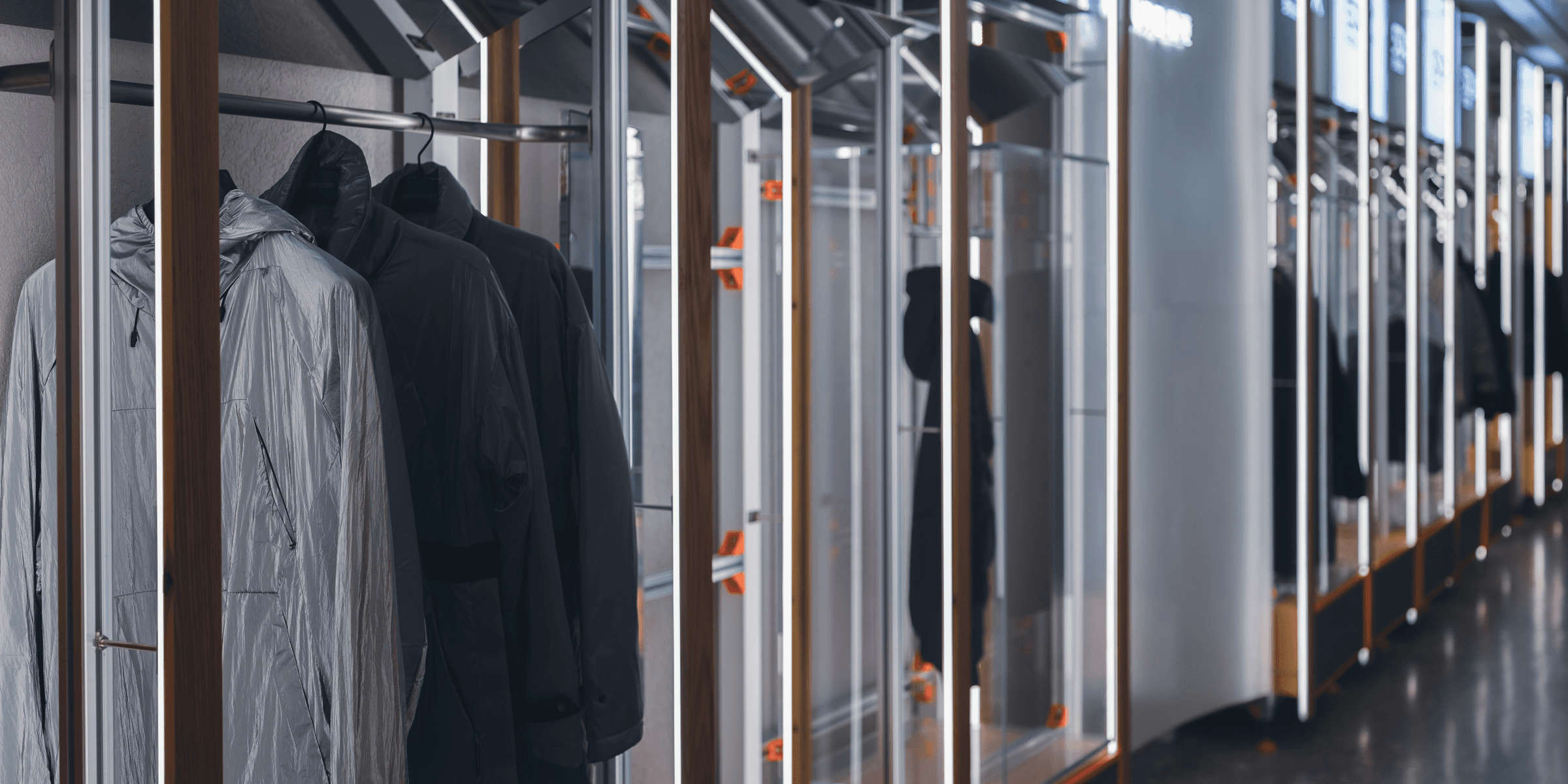 a row of clothing racks in a store.