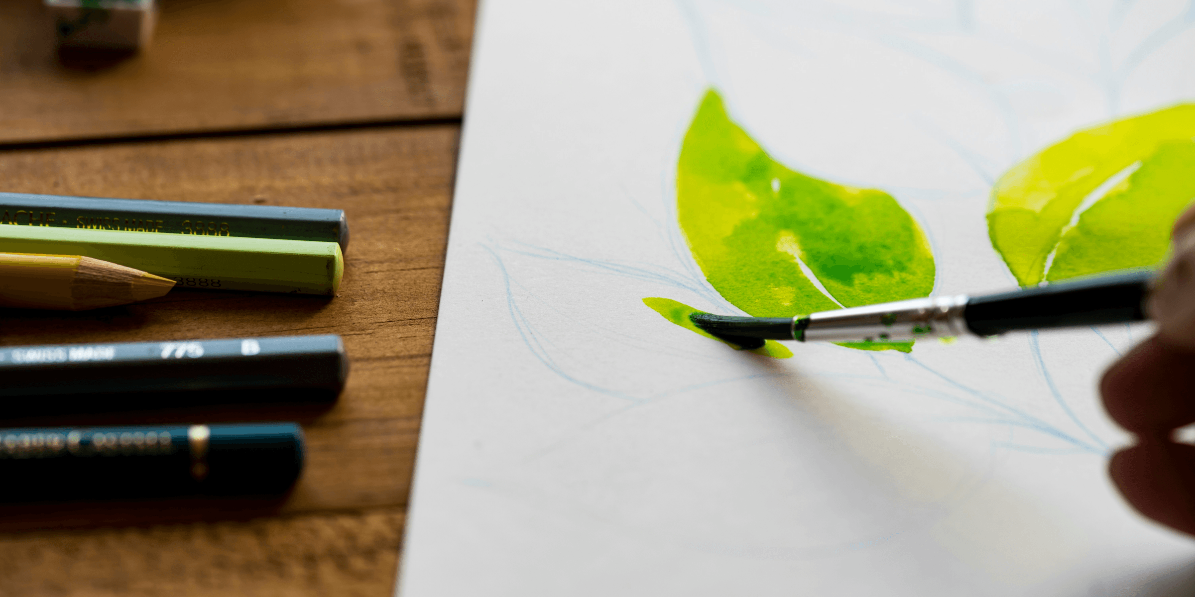 person painting leaves.