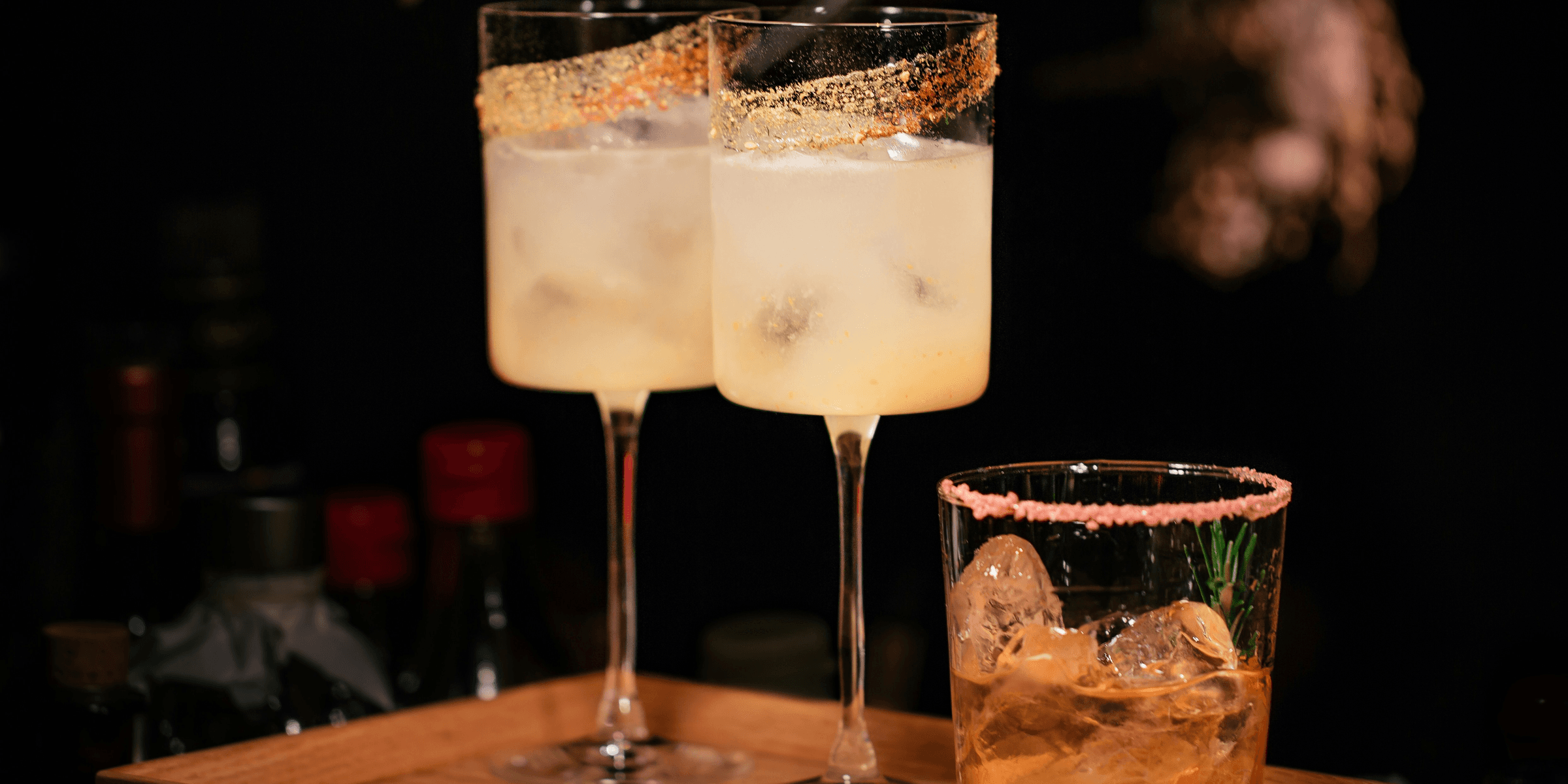 liquor filled wine glasses and rock glass.