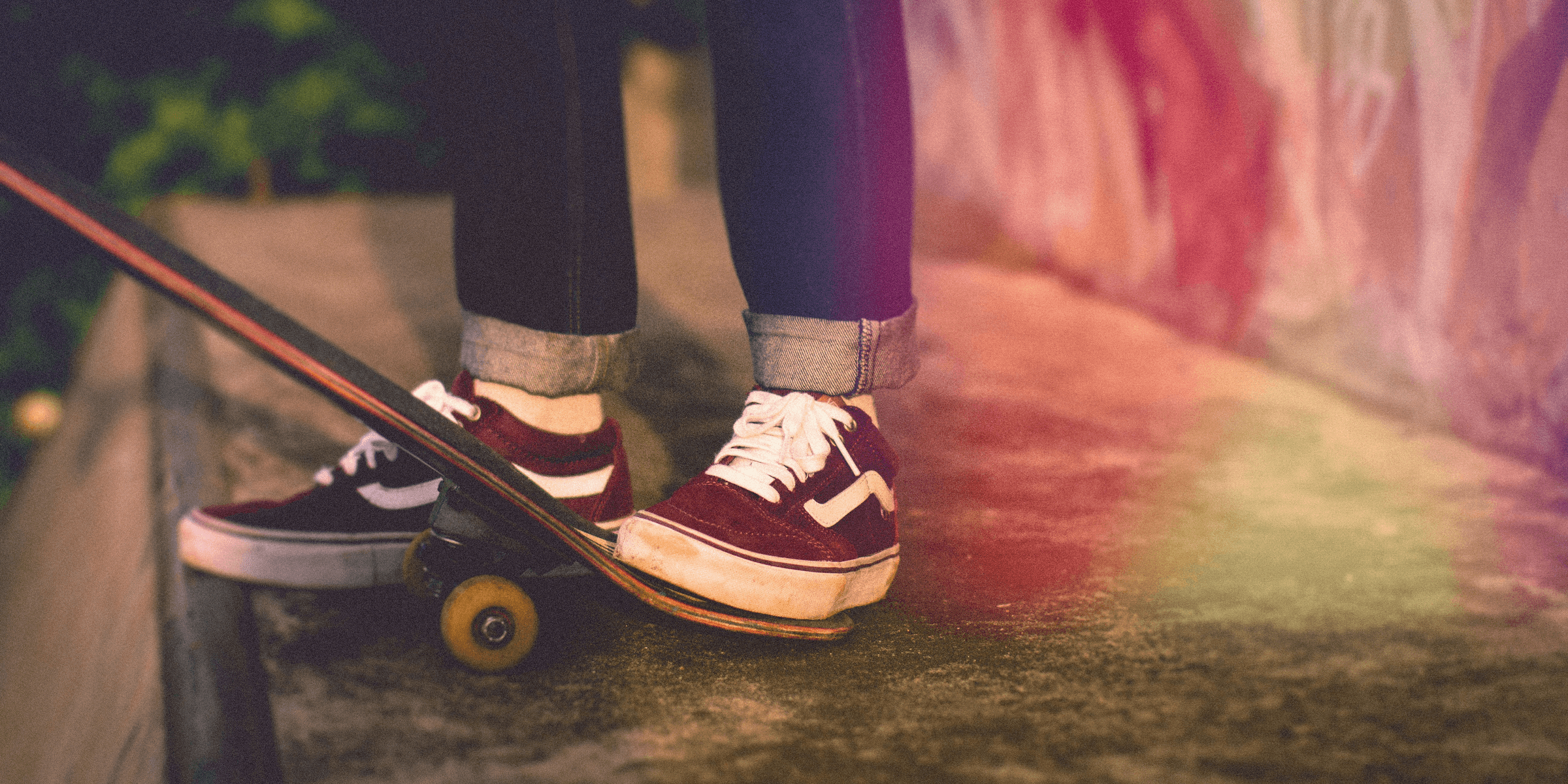 person standing beside skateboard.