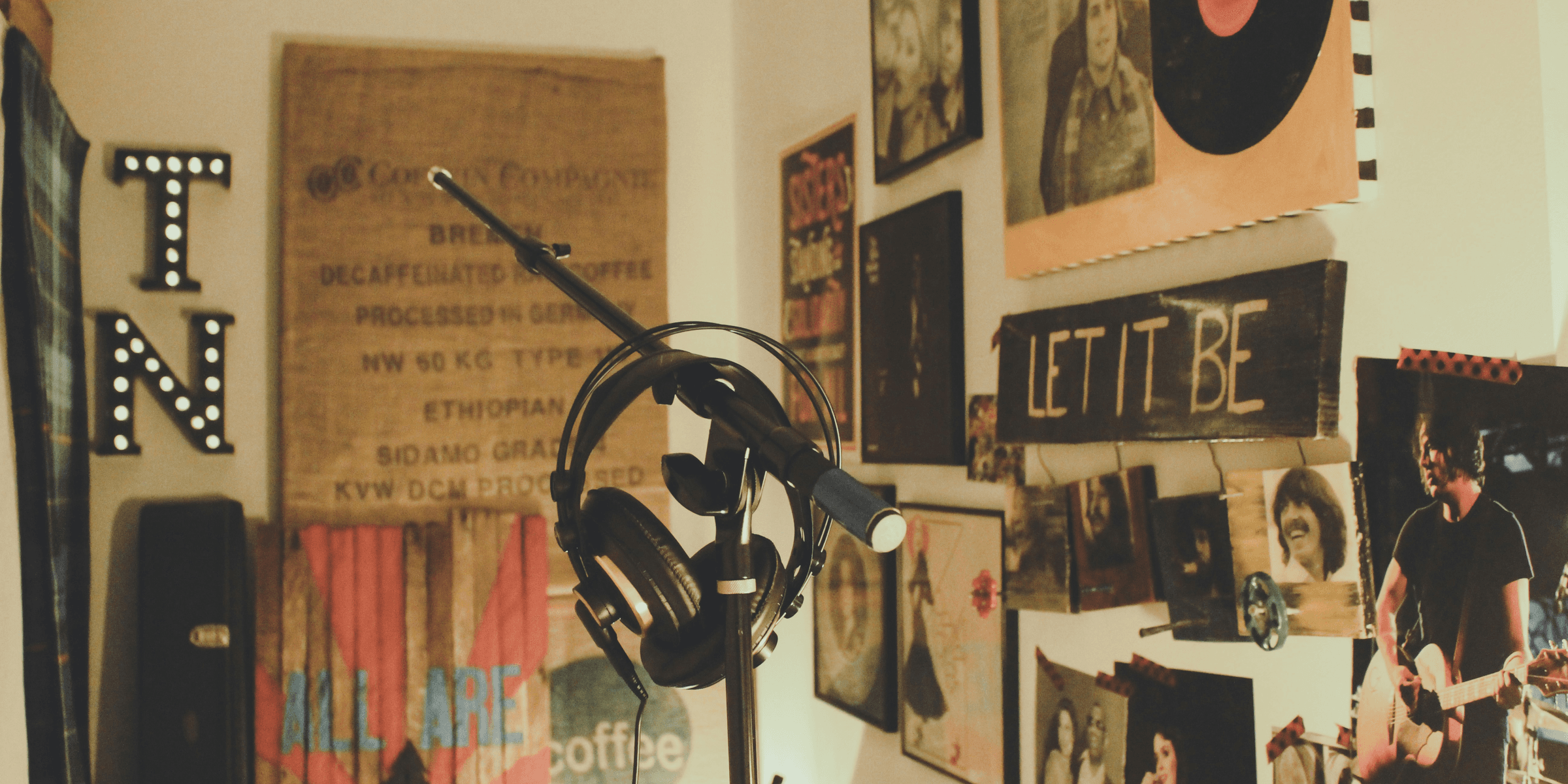 black condenser mic with stand and headphones.