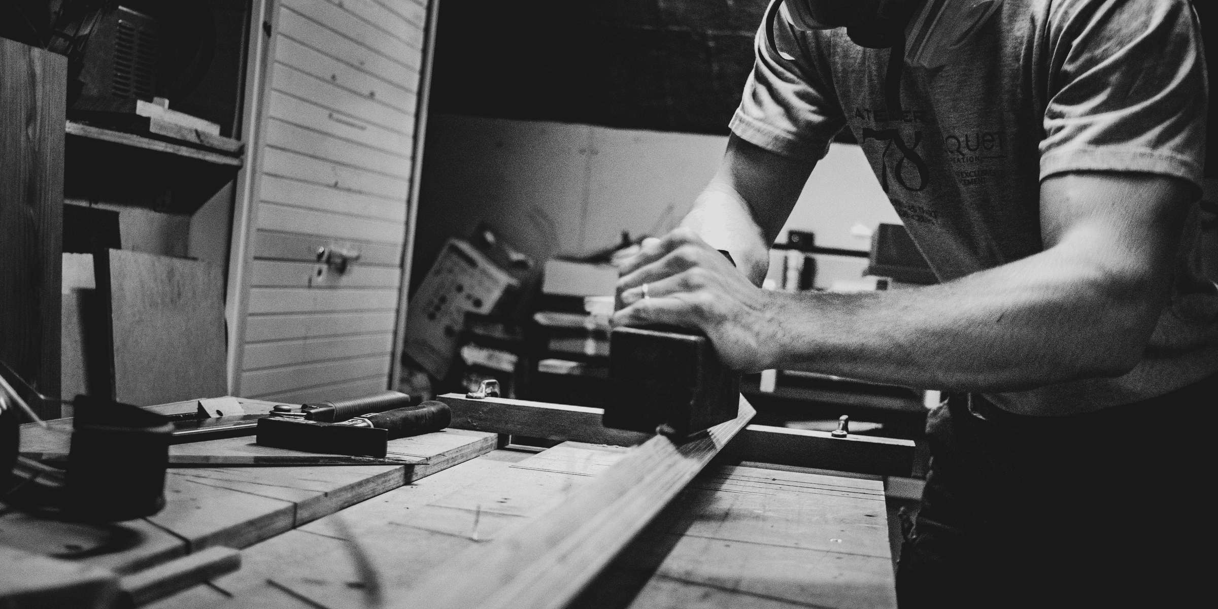 a man working on a piece of wood.
