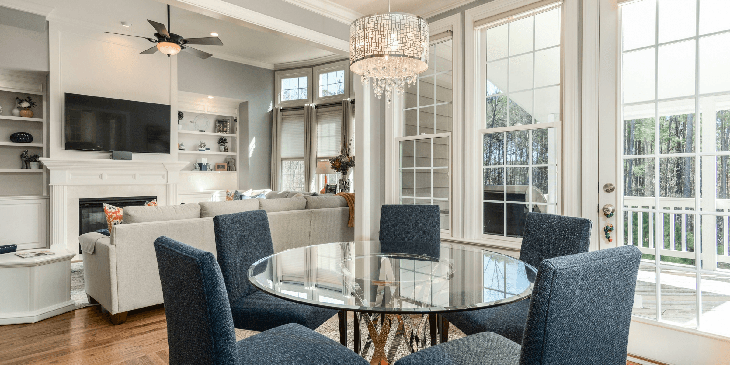 round clear glass-top table and five gray chairs dining se.