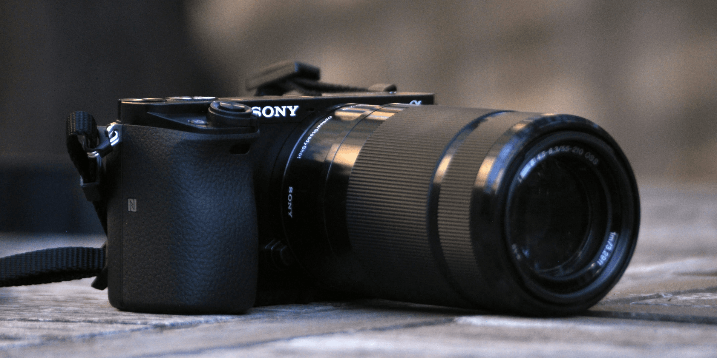 selective focus photography of Sony DSLR camera.