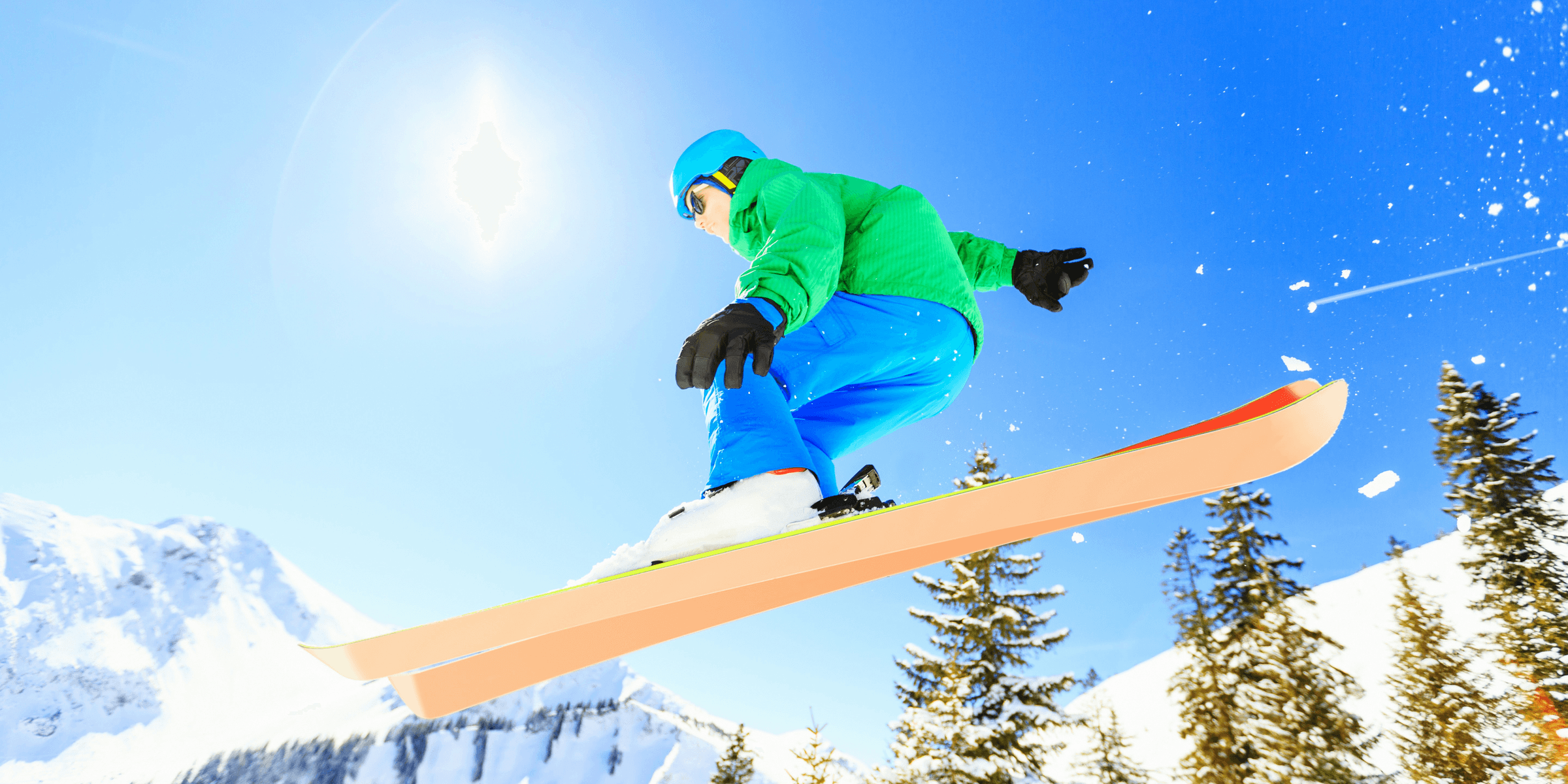 person wearing green jacket riding snow skis.