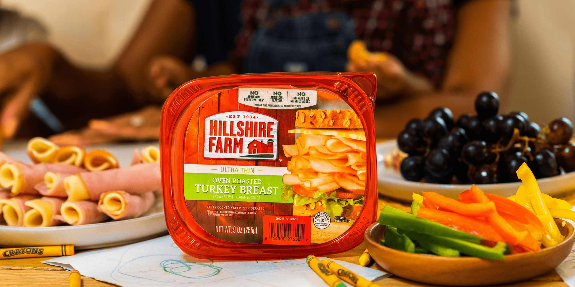 orange plastic container on white paper.