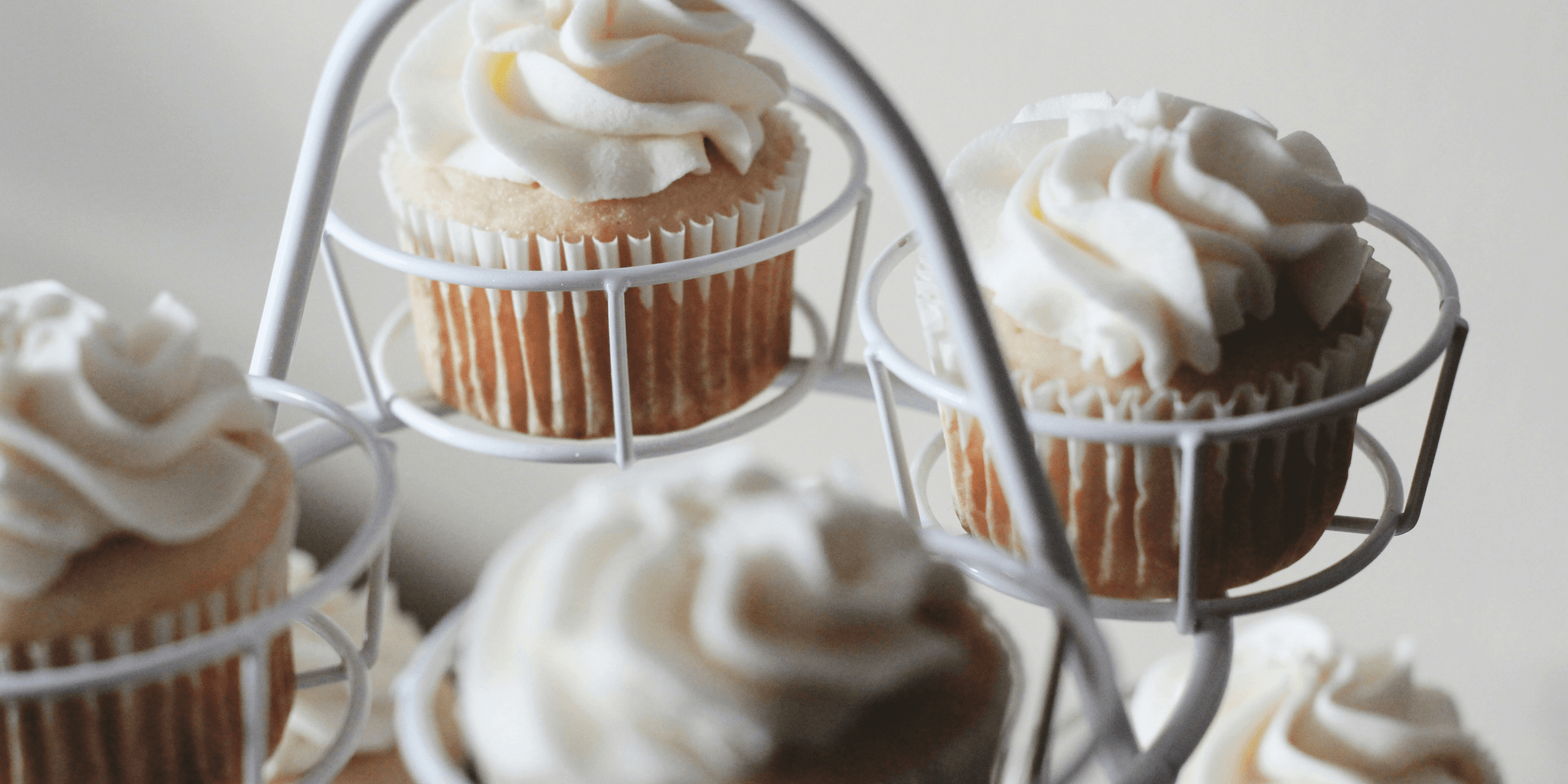 photo of baked cupcakes on white cupcake tray.