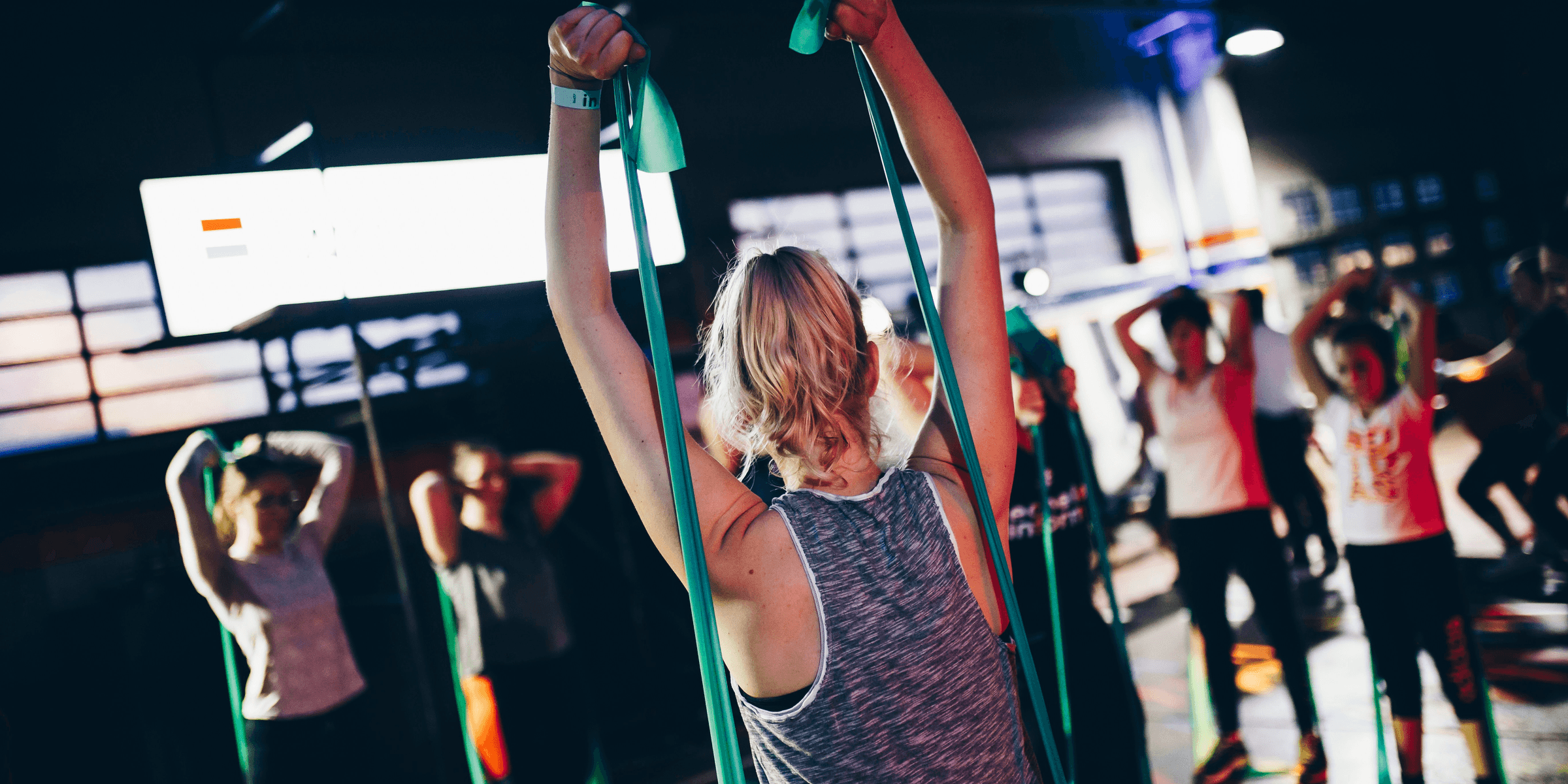 group of people in gym while exercising.