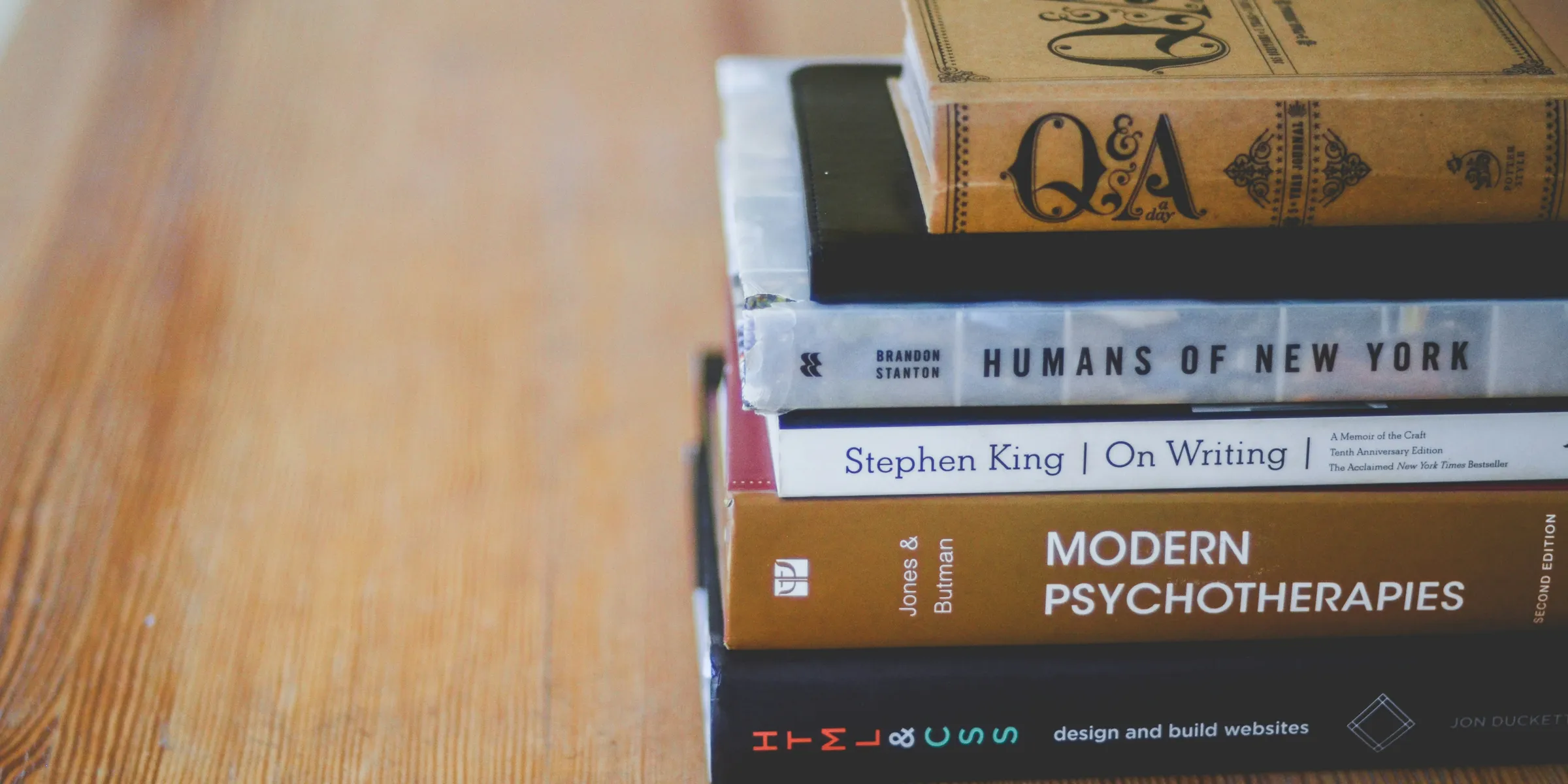 assorted reading books on table
