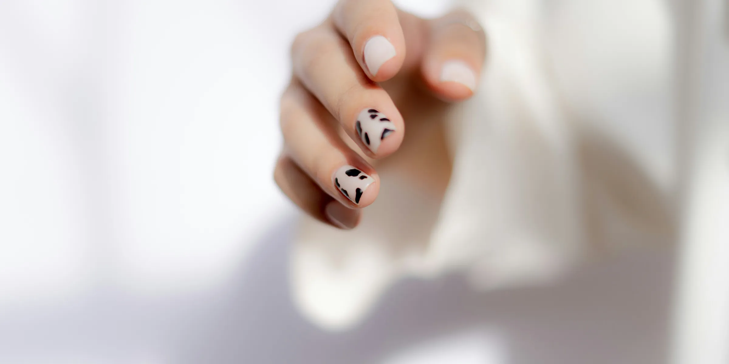 a hand with painted nails