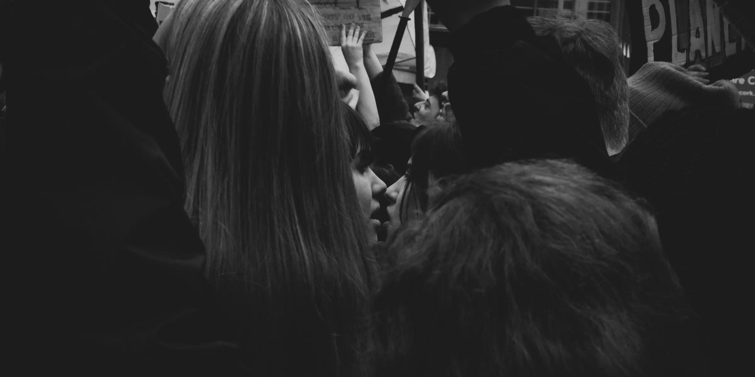 a group of people standing around each other