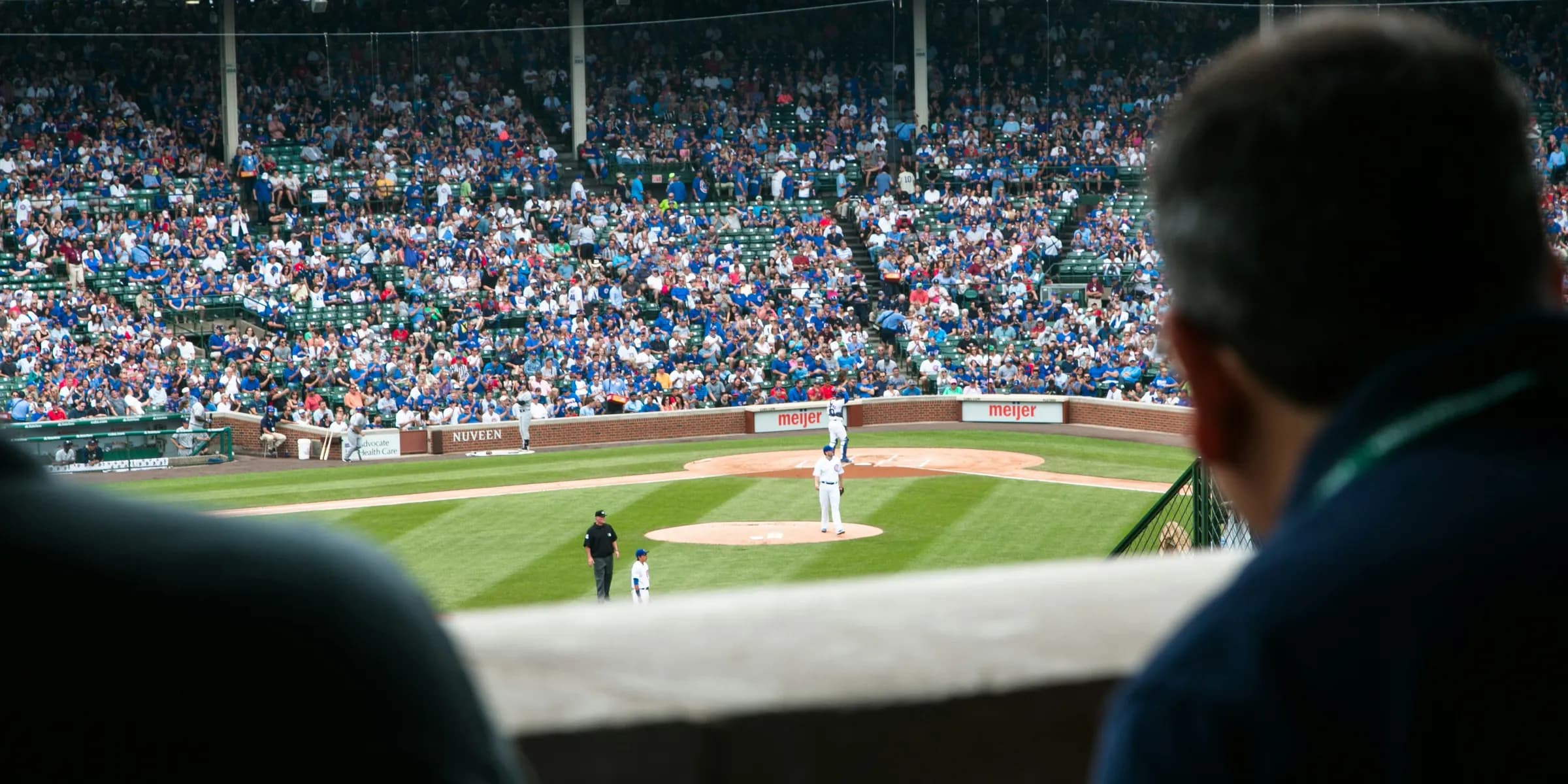 group of people watching baseball game