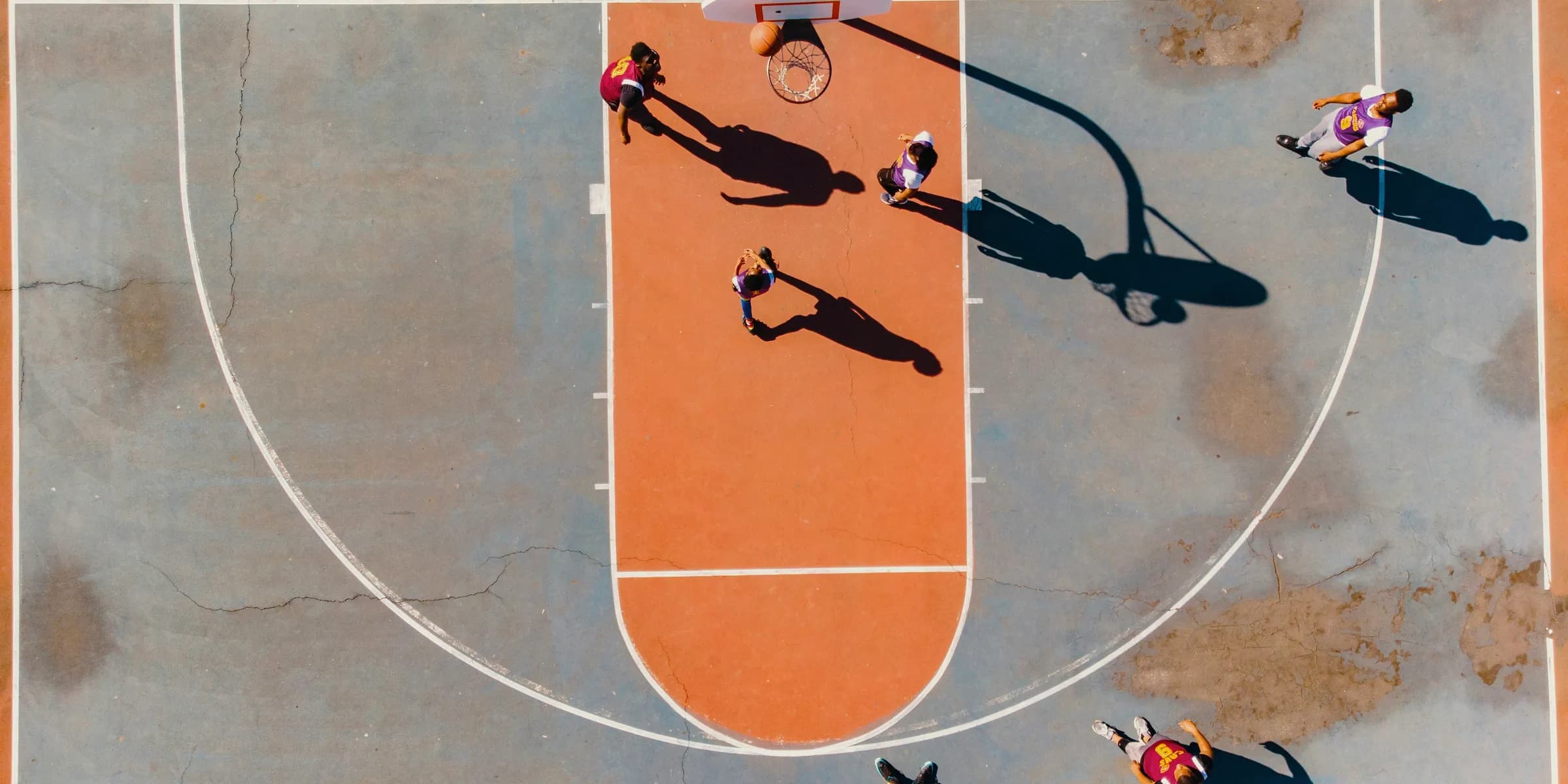 aerial photography of men playing basketball