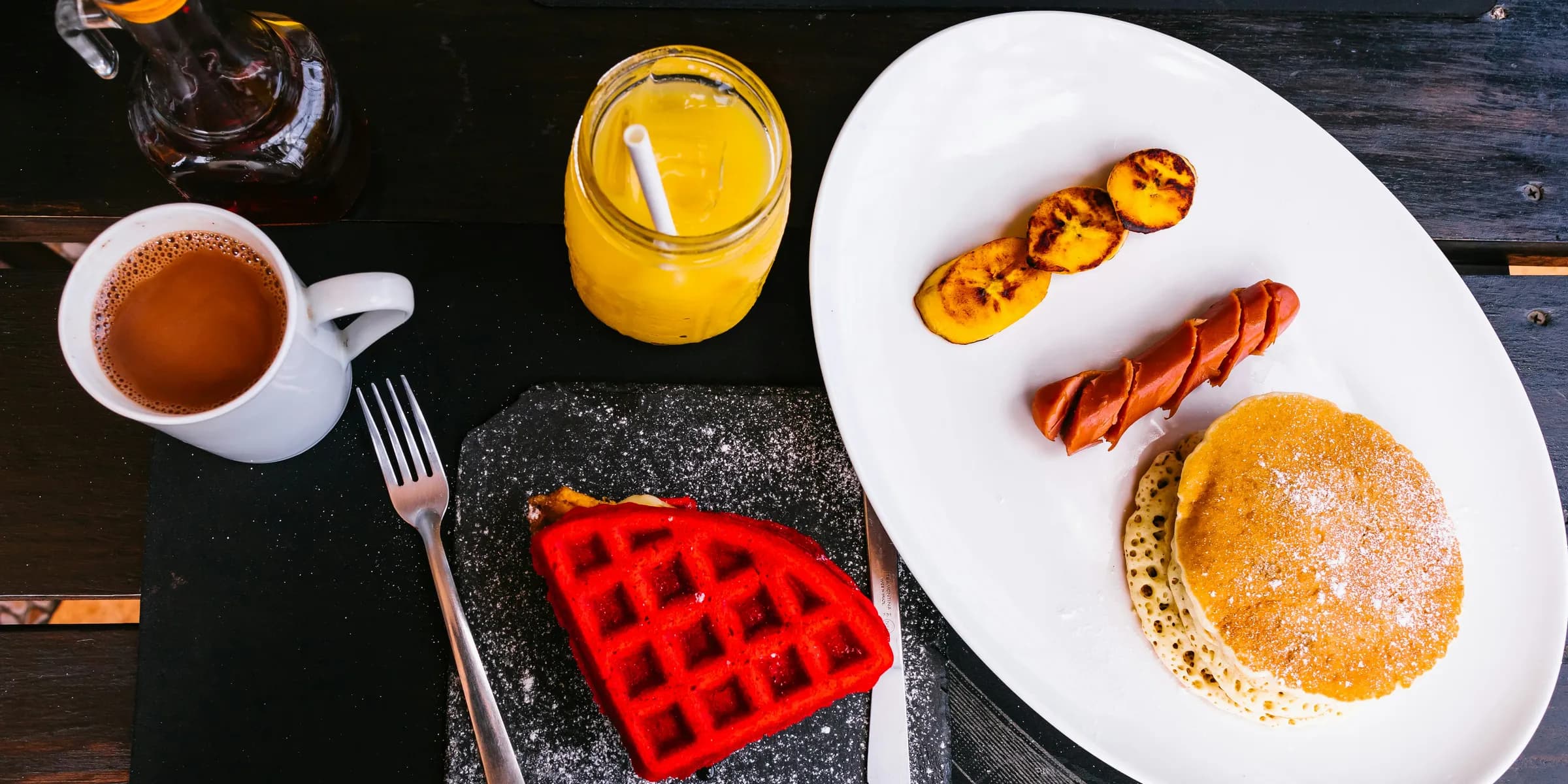 sausage between fried banana and pancake