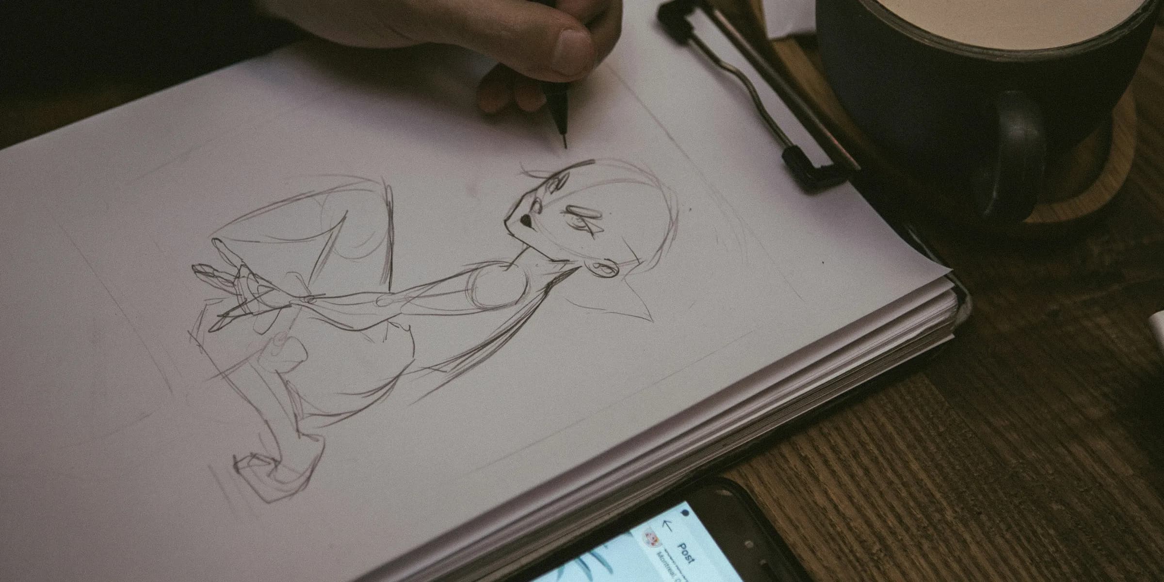 man drawing portrait of man