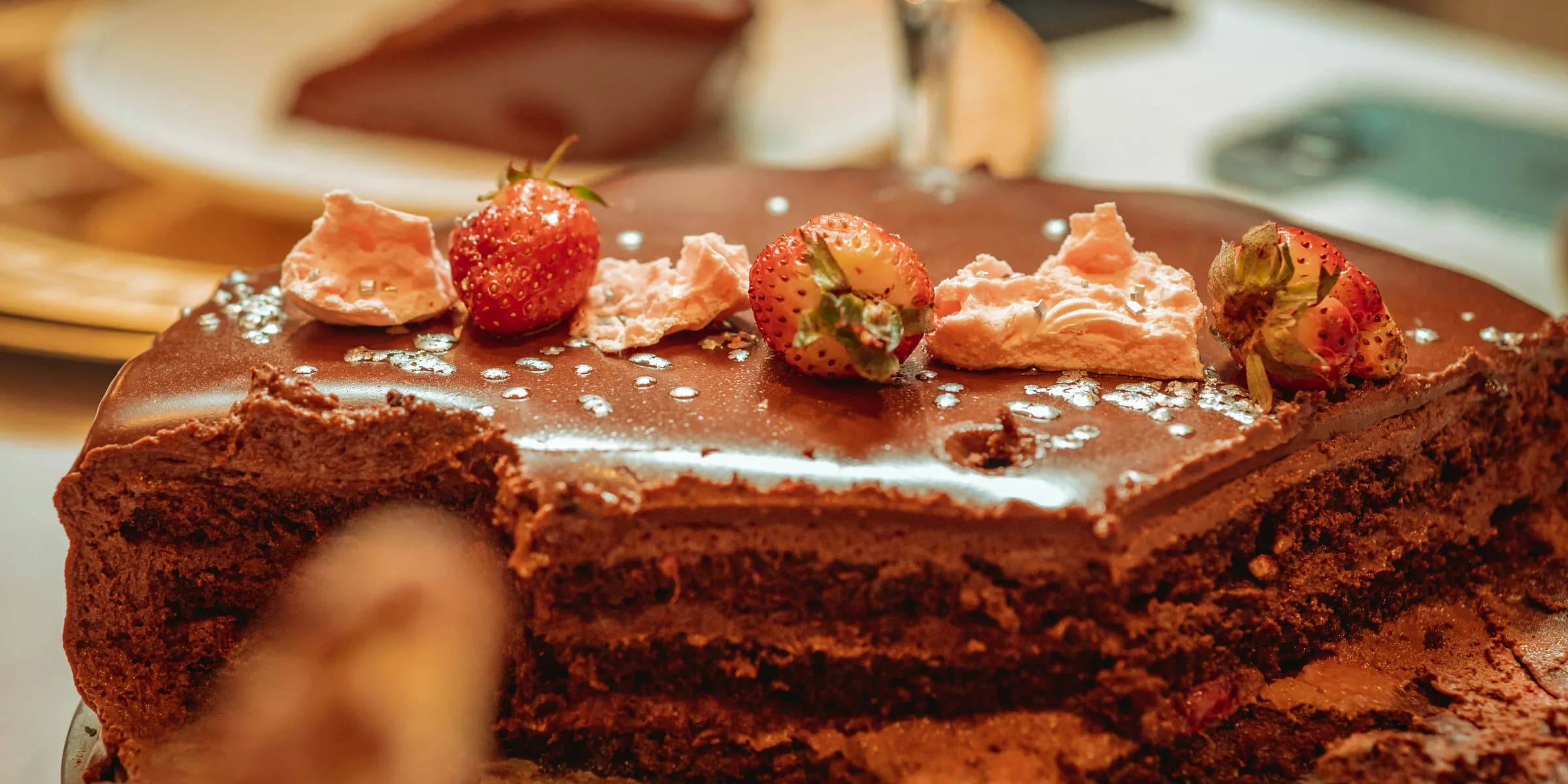 a chocolate cake with strawberries on top of it