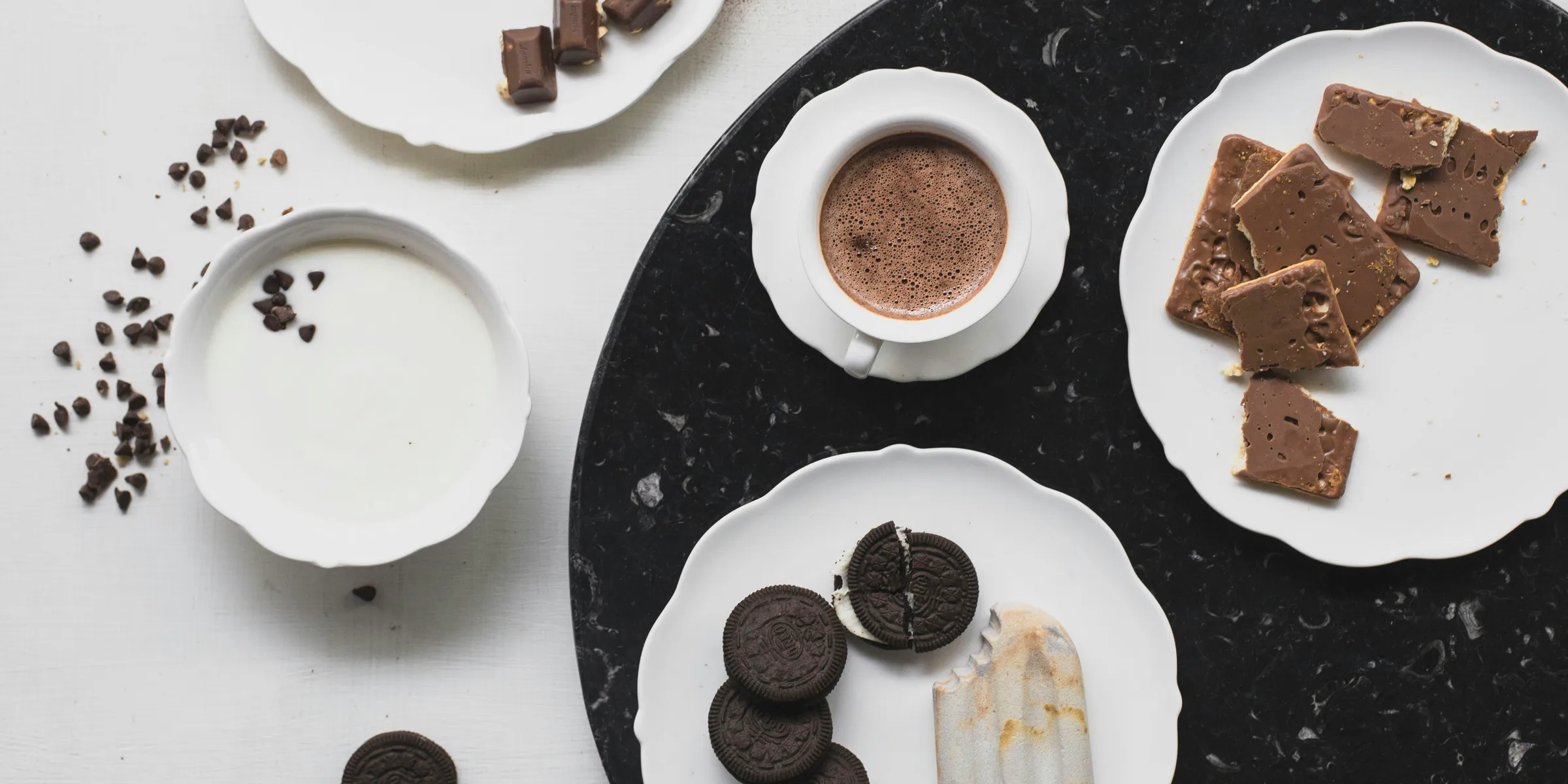 cookies on white ceramic plate with ice cream and chocolate drink