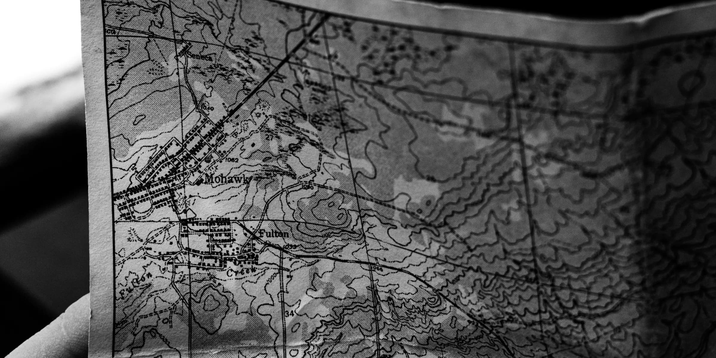 a person holding a map in their hand