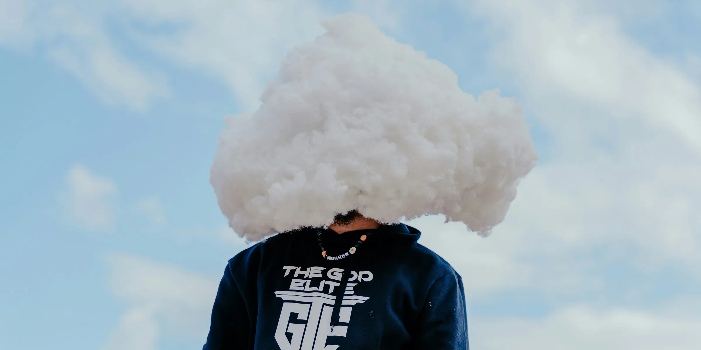 a person with a cloud on their head