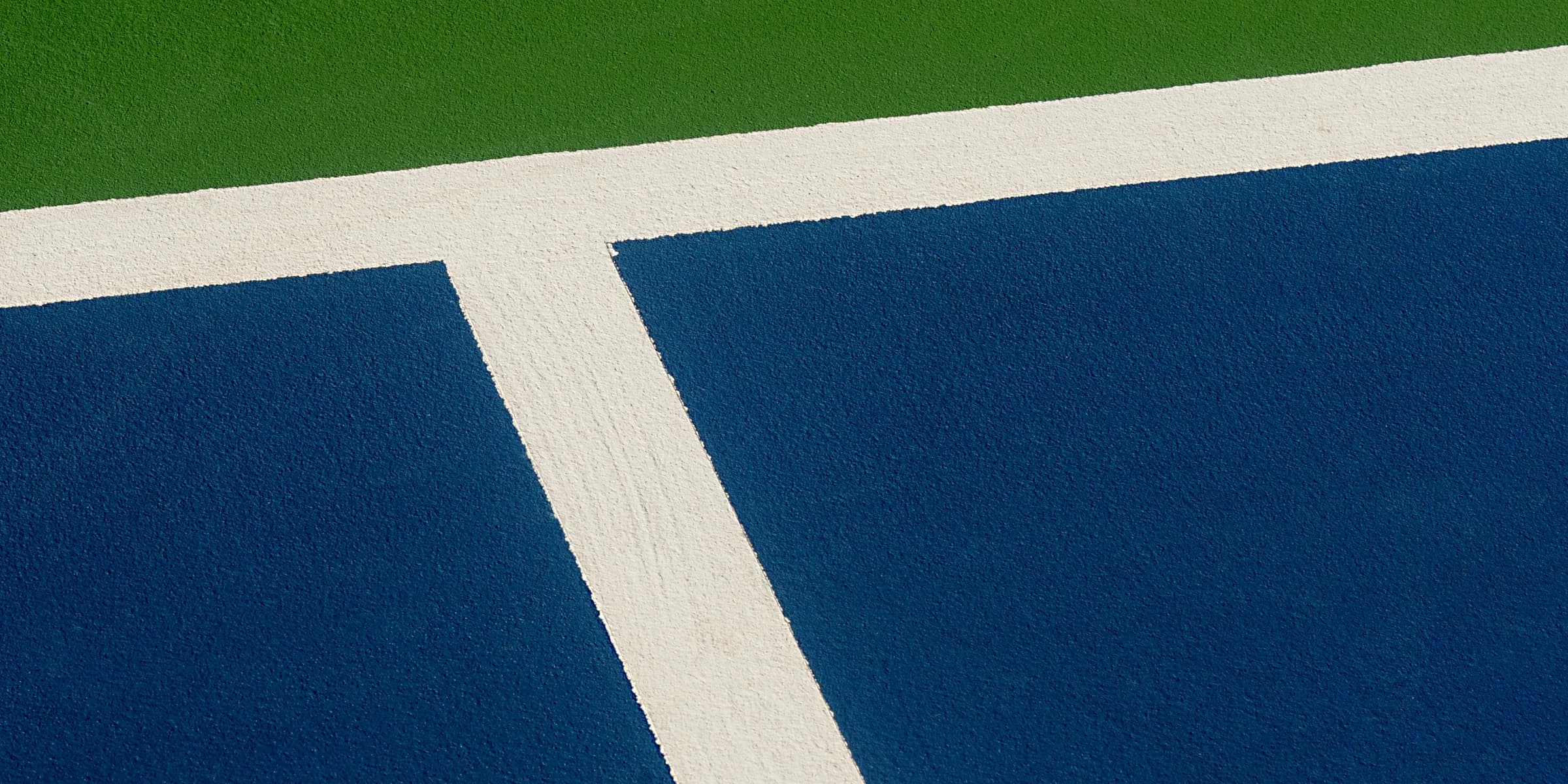 a tennis player on a court with a racket