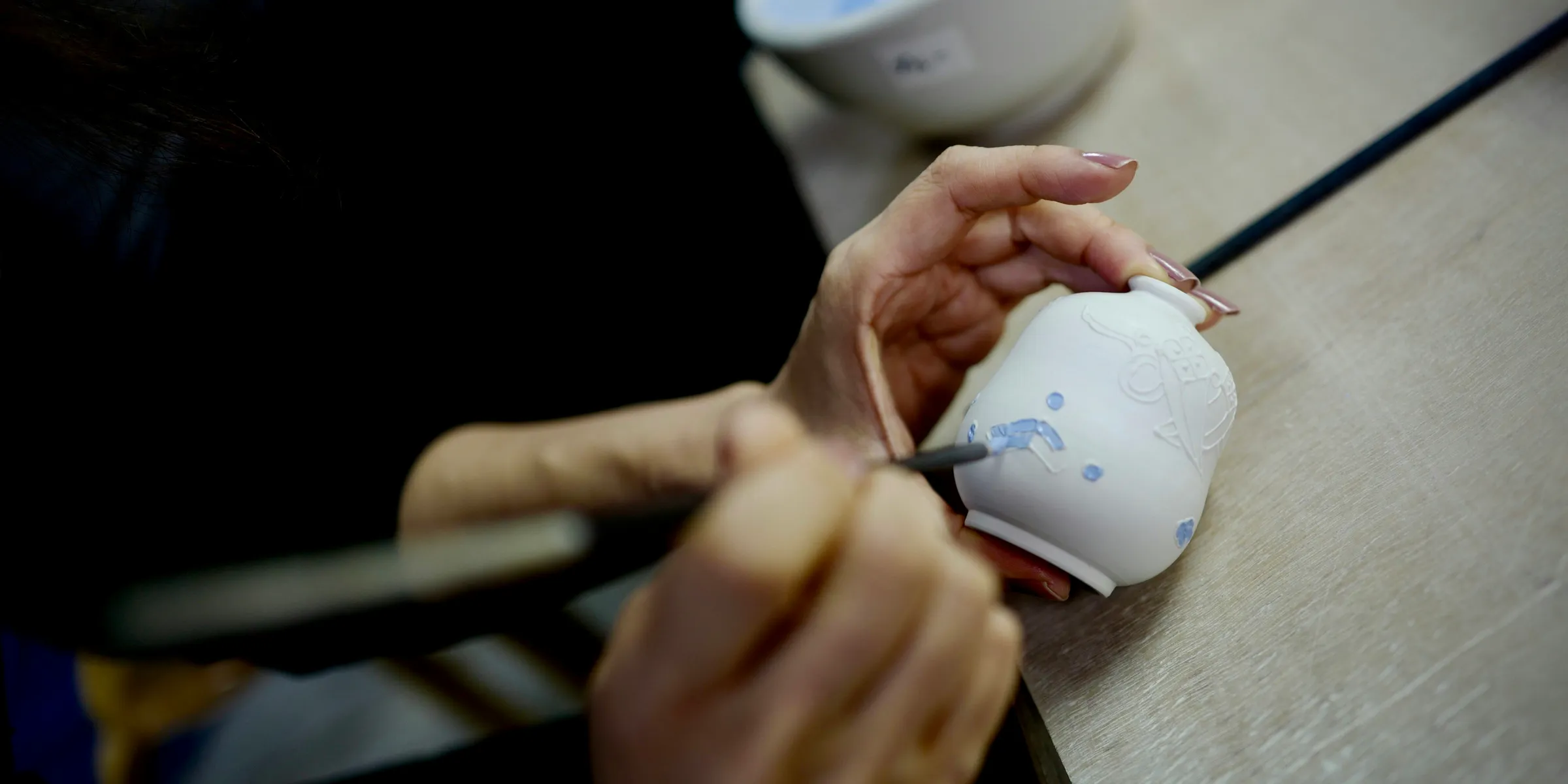 person holding white ceramic mug