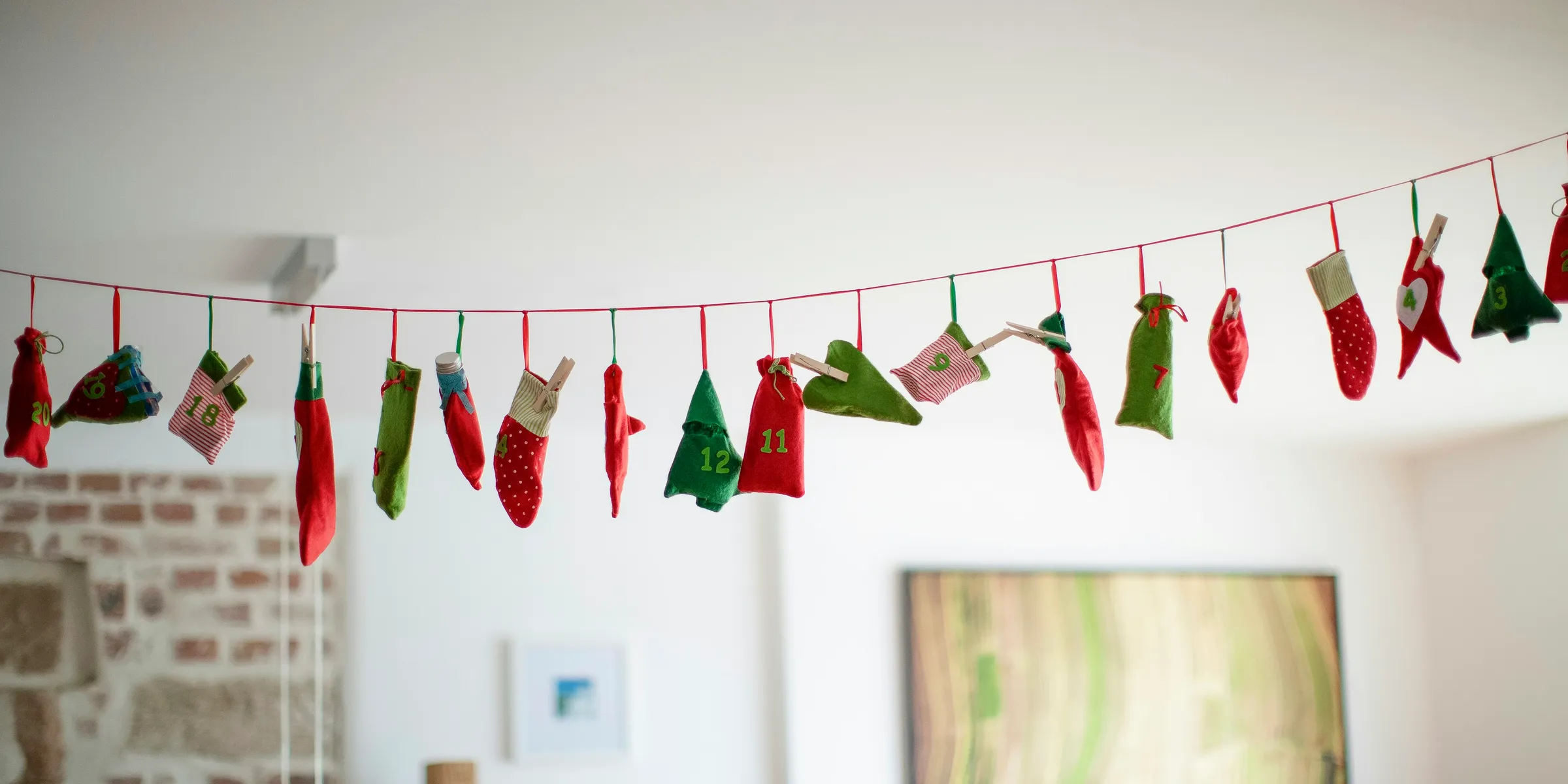 assorted Christmas decors hanging on string indoors