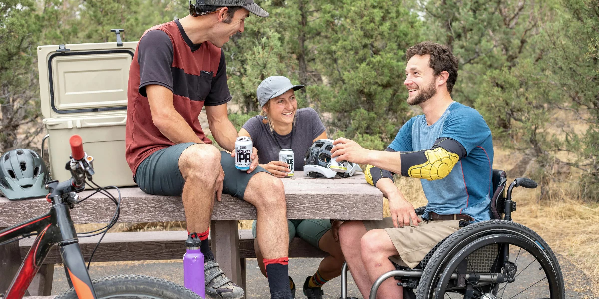 three people having conversation inside park