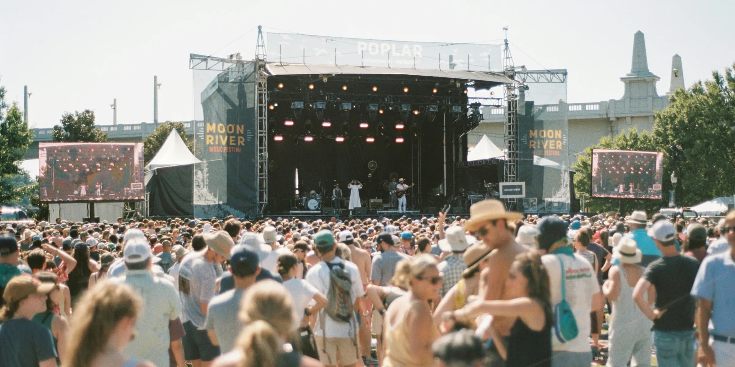 people on open space near stage during daytime