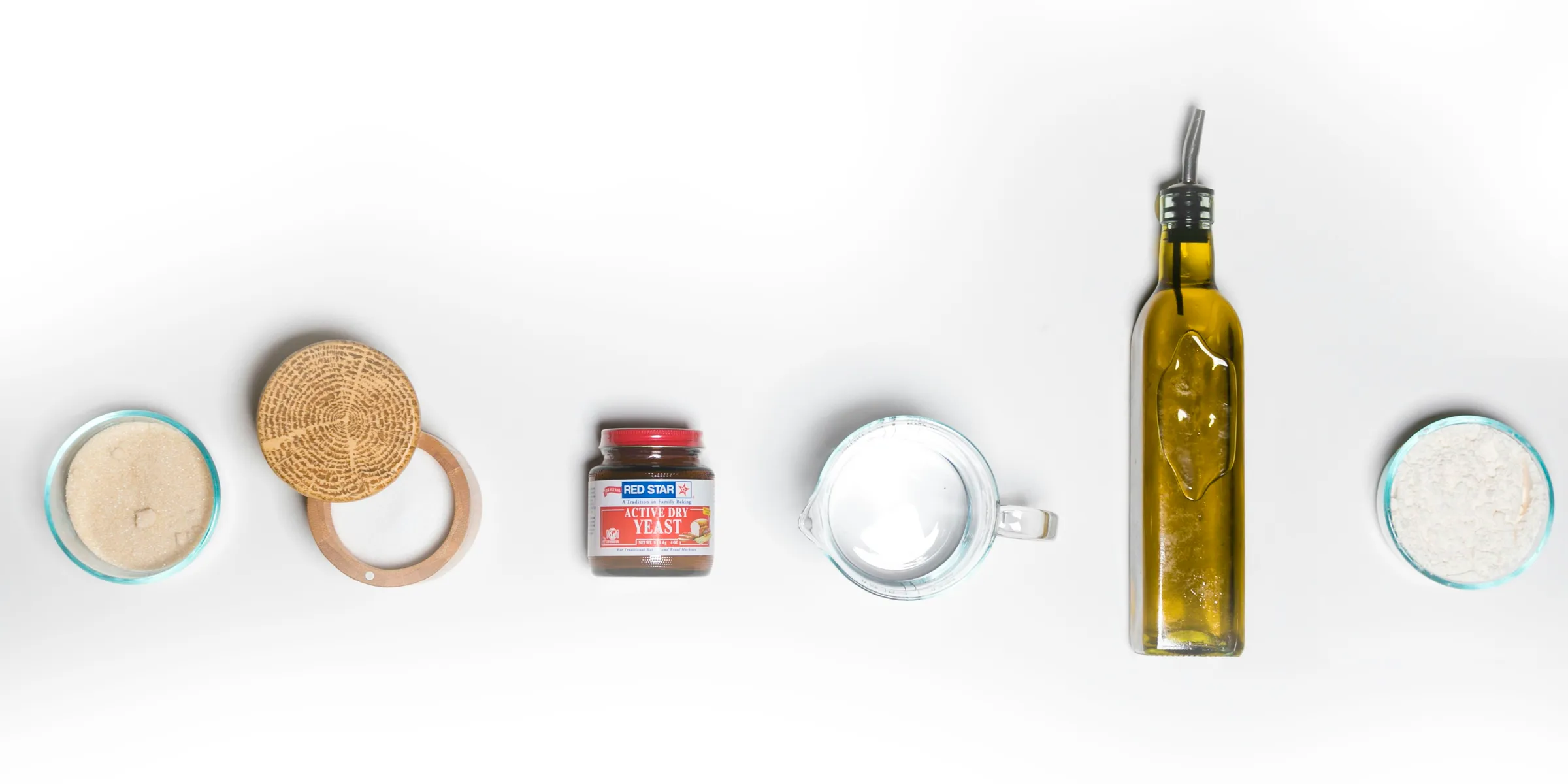 a white table topped with different types of food