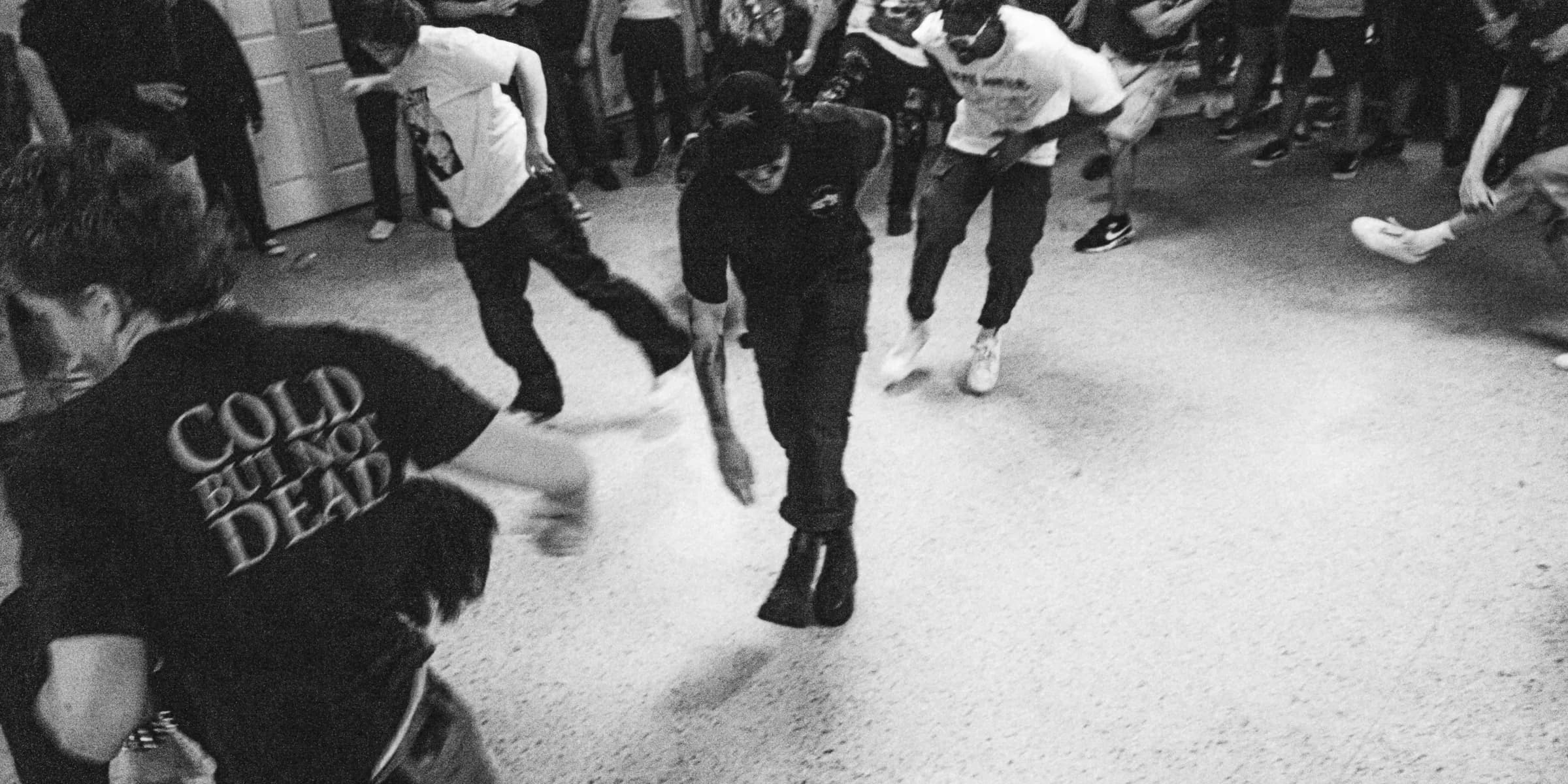 a group of young people dancing in a room